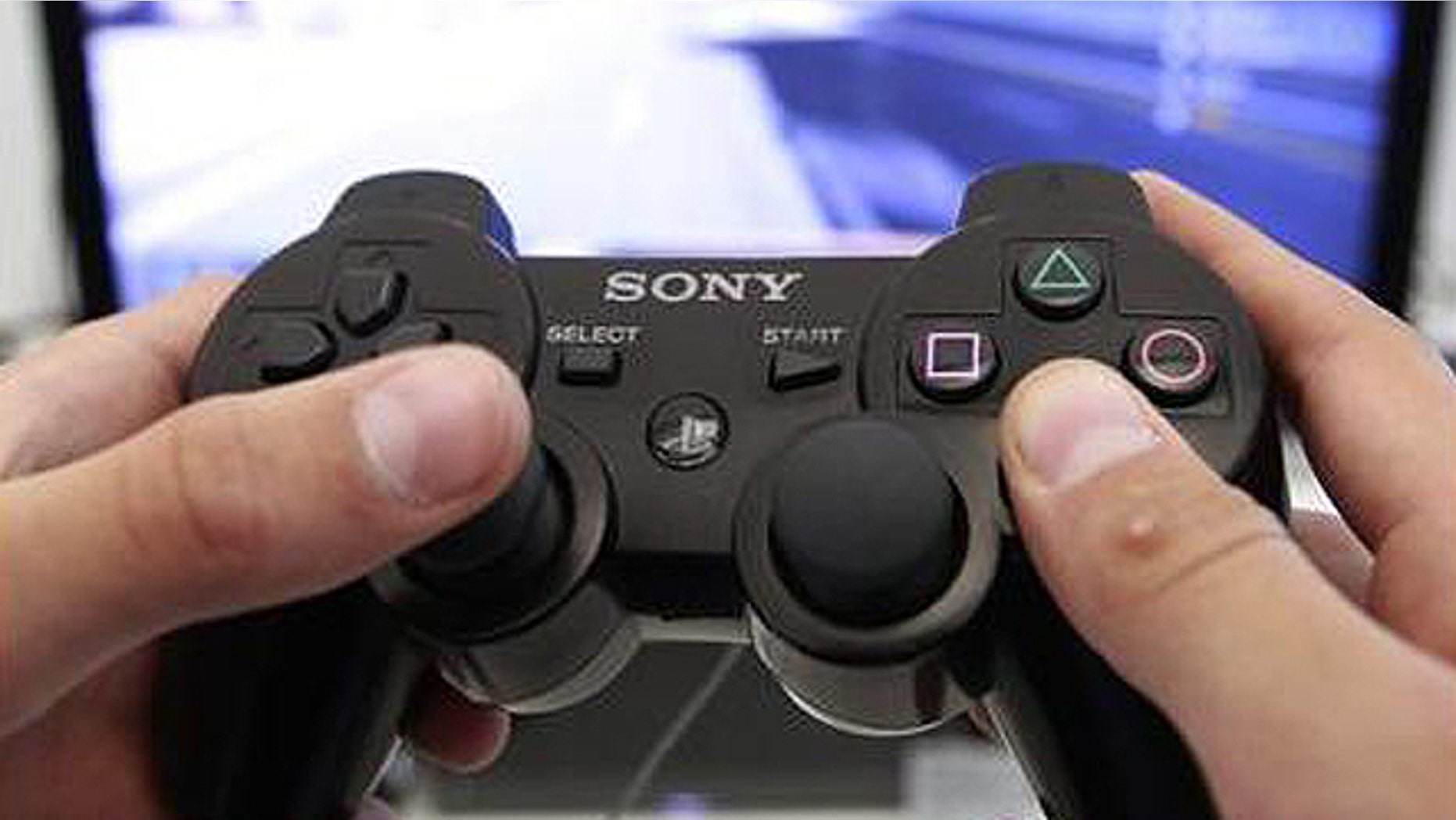 A person plays a video game at a Sony Playstation in the Sony's flagship store in Berlin, April 27, 2011.