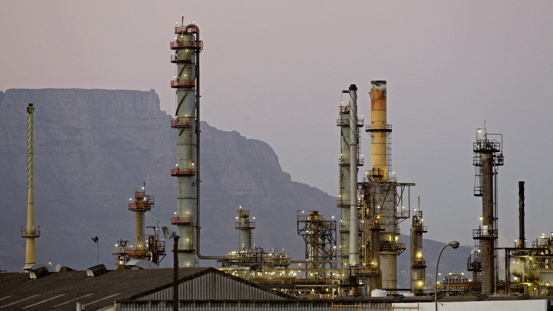 Feb. 8, 2012: An oil refinery is seen with Table Mountain in the background, Cape Town, South Africa.
