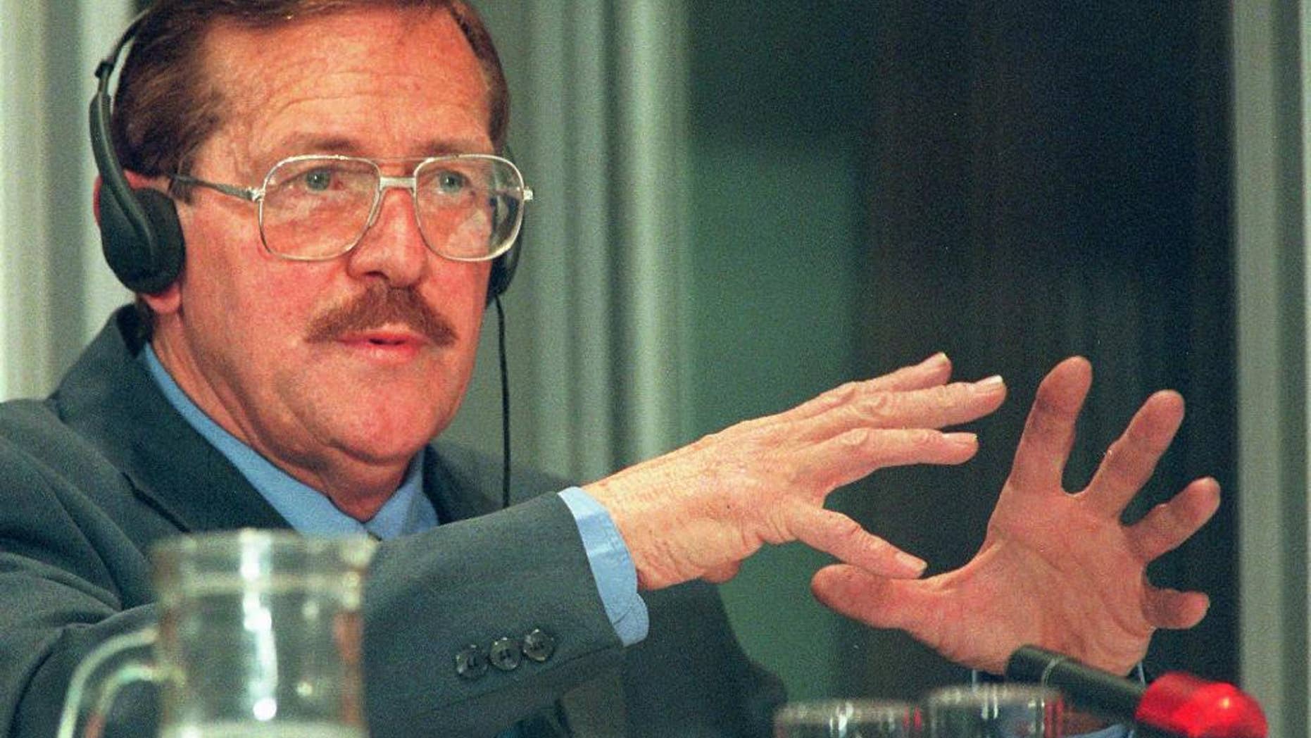 FILE - In this Tuesday Aug. 19, 1997 file photo, former Conservative Party politician Clive Derby-Lewis, makes a statement at an amnesty hearing in Pretoria, South Africa. On Friday, May 29, 2015 a judge granted parole to Derby-Lewis who was convicted for the 1993 assassination of Chris Hani, leader of the South African Communist Party and head of the African National Congress' military wing during apartheid, for which he received a life sentence. (AP Photo/Joao Silva-File)