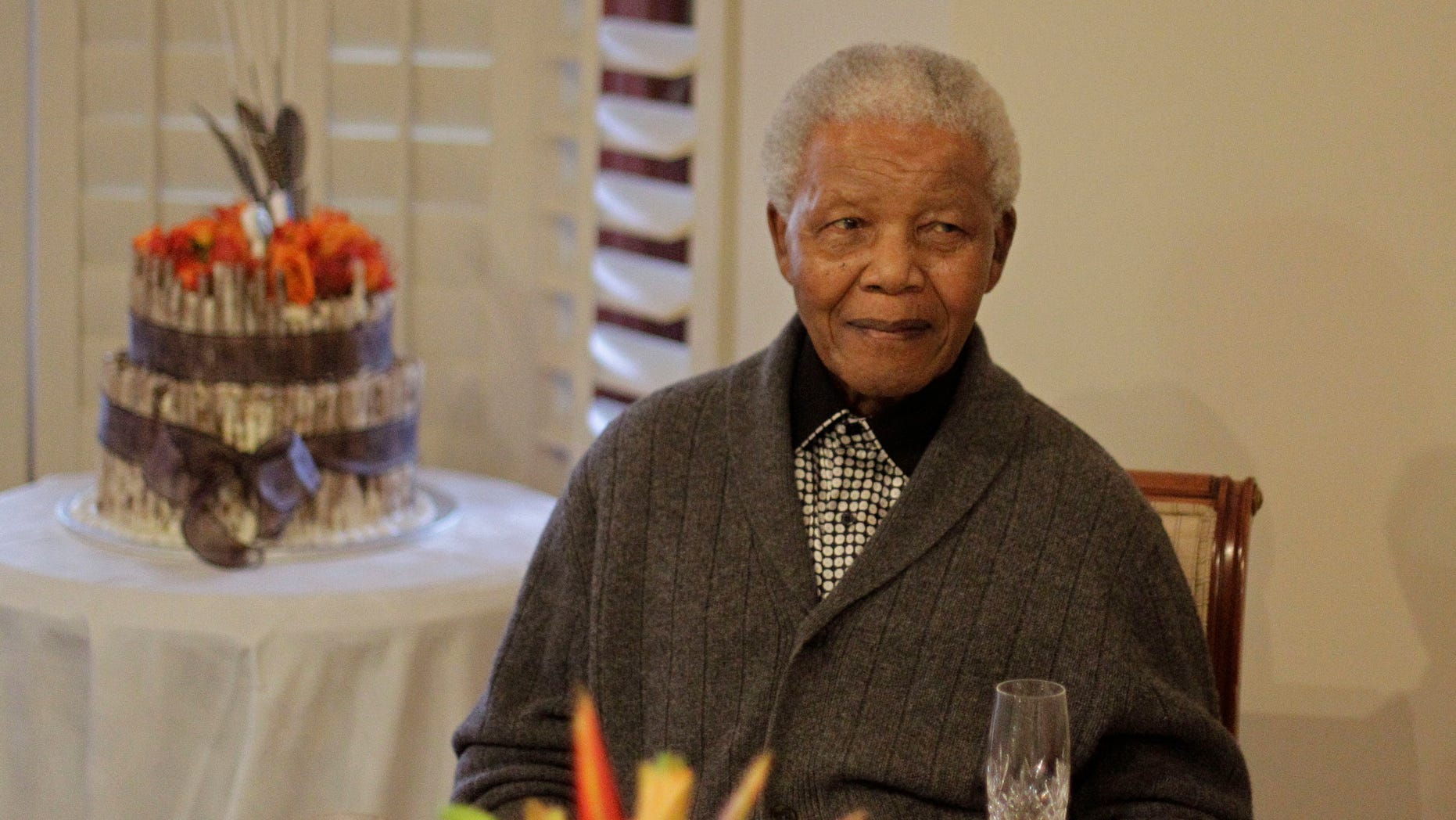 July 18, 2012: File photo, former South African President Nelson Mandela as he celebrates his birthday with family in Qunu, South Africa. South African President Jacob Zuma says that former President Nelson Mandela has been admitted to hospital in Pretoria to undergo tests. Zuma issued a statement Saturday, Dec. 8, 2012 saying that Mandela is "doing well and there is no cause for alarm."