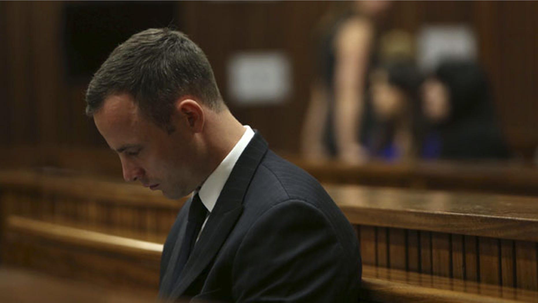 March 25, 2014: Oscar Pistorius sits in the dock in court of his murder trial in Pretoria, South Africa. Pistorius is charged with the Valentine's Day 2013 shooting death of his girlfriend Reeva Steenkamp. (AP Photo/Esa Alexander, Pool)