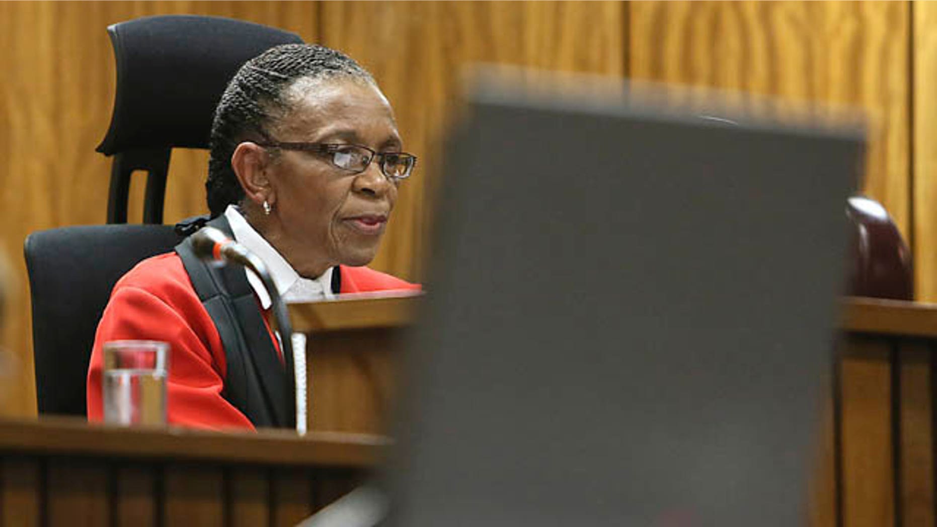 September 12, 2014: Judge Thokozile Masipa delivers her judgement in court in Pretoria, South Africa. Masipa ruled out a murder conviction for the double-amputee Olympian, Oscar Pistorius, in the shooting death of his girlfriend, Reeva Steenkamp, but said he was negligent, and convicted him of culpable homicide. (AP Photo/Alon Skuy, Pool)