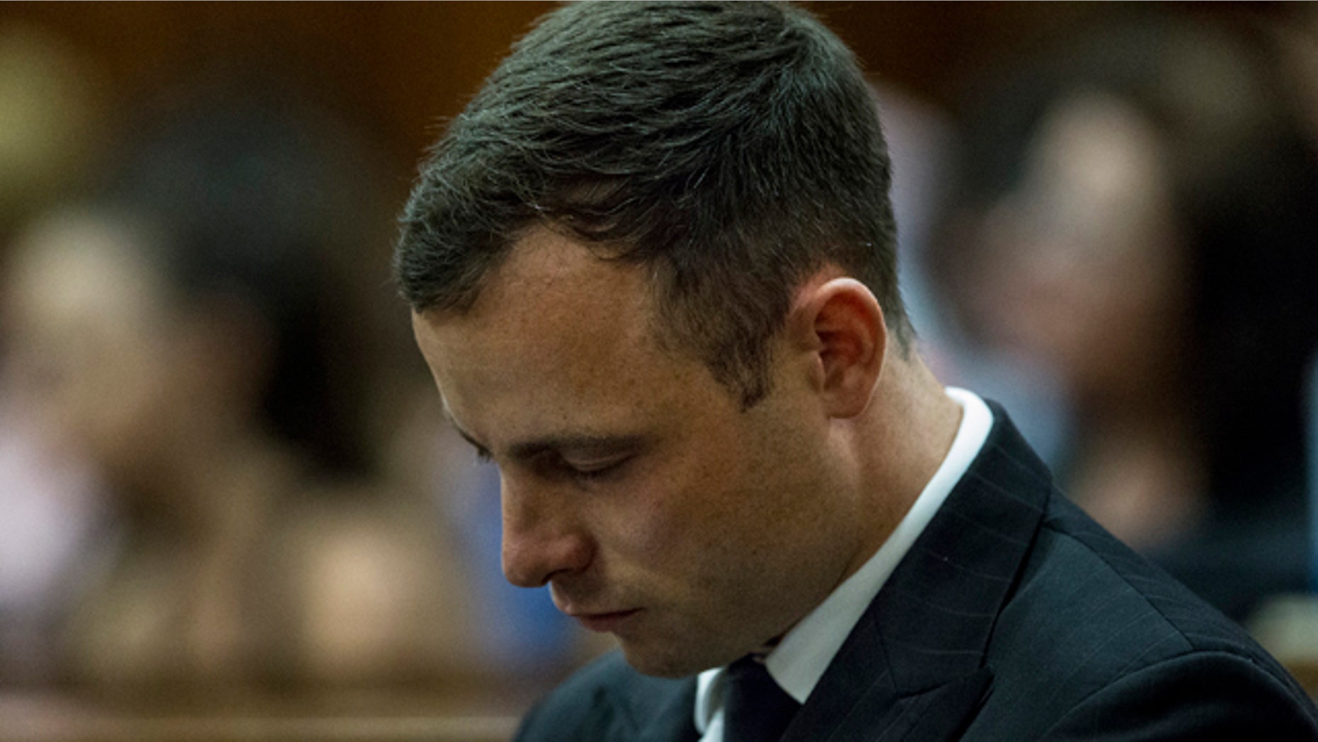 October 13, 2014: Oscar Pistorius arrives in court to face sentencing for the shooting death of his girlfriend Reeva Steenkamp. (AP Photo/Marco Longari. Pool)