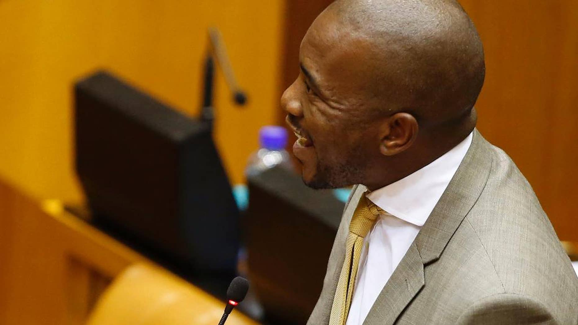 File: In this Wednesday, March 11, 2015, file photo, Opposition Democratic Alliance MP Mmusi Maimane speaks during a session in Parliament, in Cape Town, South Africa. Maimane said Monday, March 16, 2015 that race remains a "powerful trigger" in South African politics more than 20 years after the country's first all-race elections ended white racist rule . (AP Photo/Nic Bothma, Pool, File)