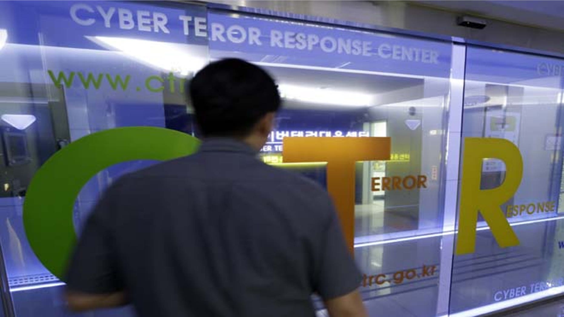 June 25, 2013: A man walks by a gate at Cyber Terror Response Center of National Police Agency in Seoul, South Korea. South Korea said multiple government and private sector websites were hacked on Tuesday's anniversary of the start of the Korean War, and Seoul issued a cyberattack alert warning officials and citizens to take security measures.