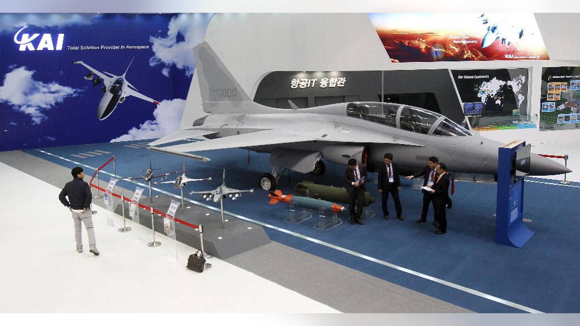 In this Oct. 28, 2013, photo, a South Korea's FA-50 fighter jet manufactured by the Korea Aerospace Industries (KAI) is displayed during a media day of Seoul International Aerospace and Defense Exhibition in Goyang, South Korea. South Korea says it has chosen the KAI, a state-run aircraft maker, as the sole preferred bidder for a contract to develop a mid-level fighter jet for about $7.8 billion with the help of Lockheed Martin Corp. (AP Photo/Ahn Young-joon)