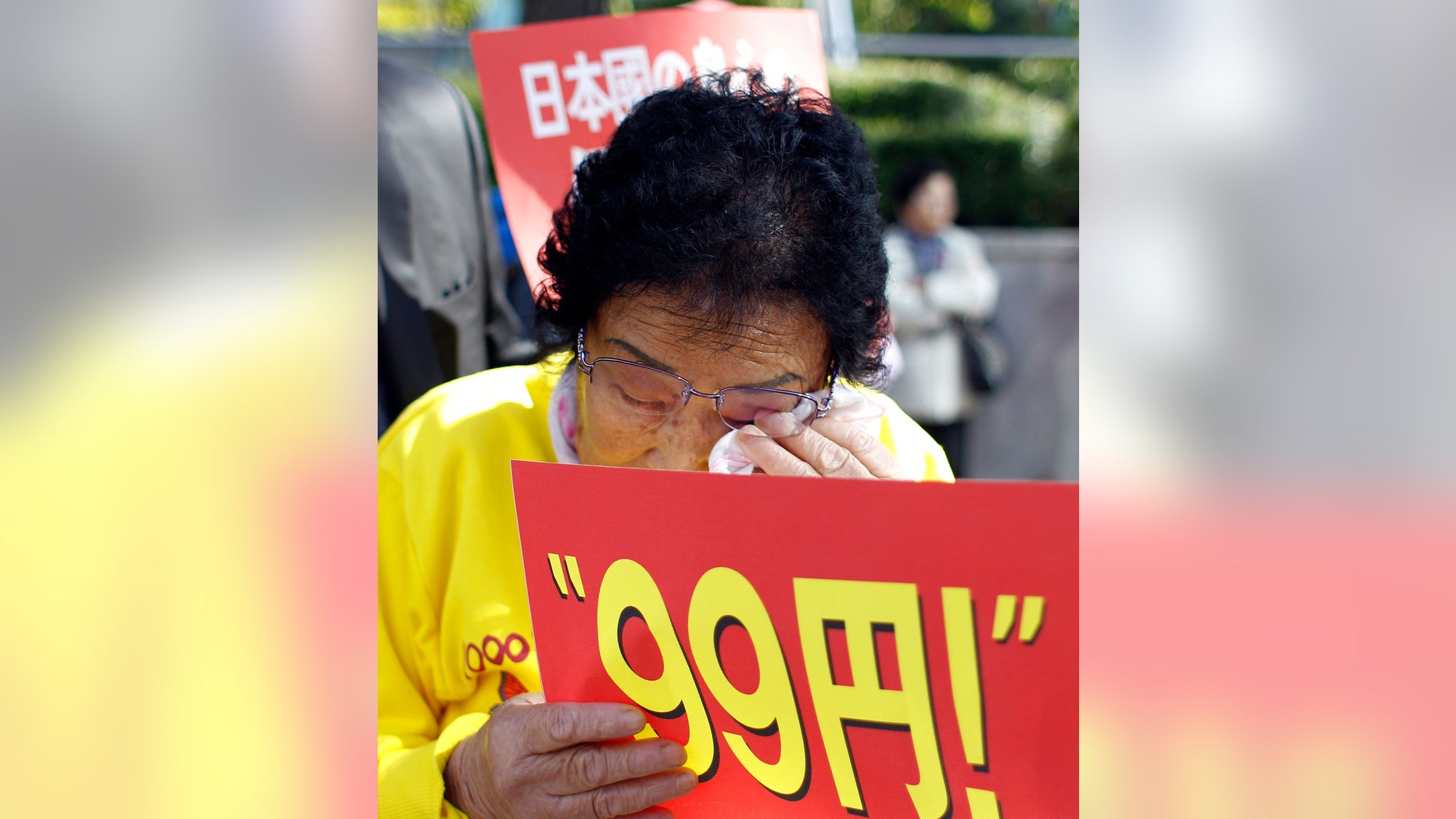 Oct. 18, 2011: 83-year-old Yang Keum-duk, who said was forced to work in Japan during the 1910-45 colonization of the Korean Peninsula, wipes her tear during a rally ahead of Japanese Prime Minister Yoshihiko Noda's visit in front of the Japanese Embassy in Seoul, South Korea.