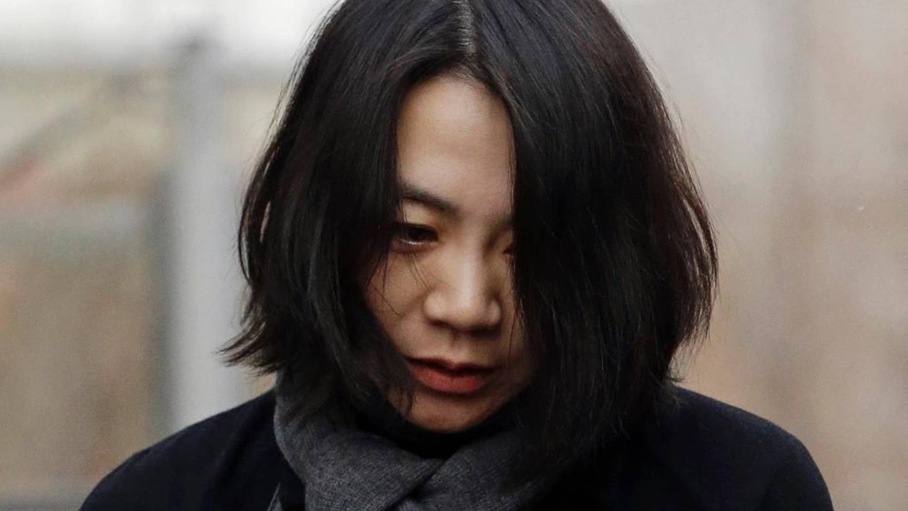FILE - In this Dec. 12, 2014 file photo, Cho Hyun-ah, who was head of cabin service at Korean Air and the oldest child of Korean Air Chairman Cho Yang-ho, speaks to the media upon her arrival for questioning at the Aviation and Railway Accident Investigation Board office of Ministry of Land, Infrastructure and Transport in Seoul, South Korea. South Korean prosecutors are seeking to detain the former executive at Korean Air Lines Co. who forced a flight to return over a bag of macadamia nuts and a current executive for attempts to cover up the "nut rage" case. Seoul Western Prosecutors' Office said Wednesday, Dec. 24, 2014 that Cho Hyun-ah faces charges including inflight violence and changing a flight route. (AP Photo/Lee Jin-man, FIle)