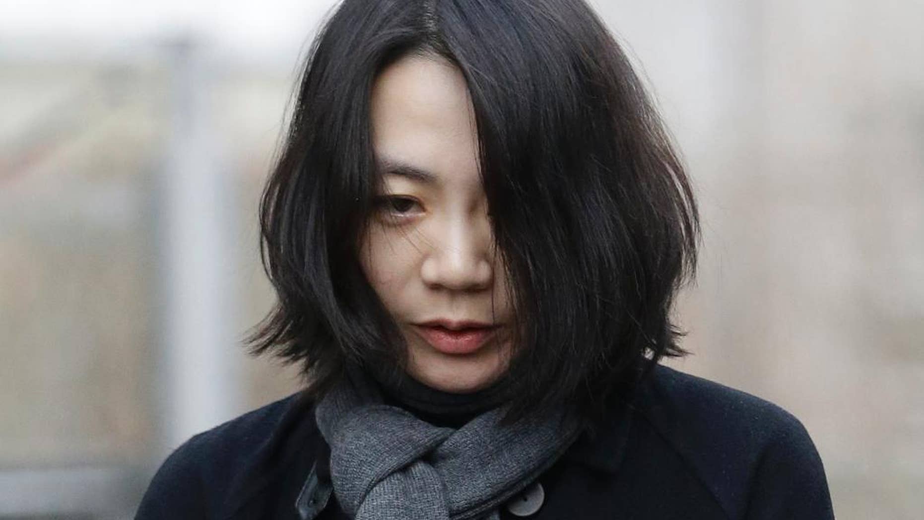FILE - In this Dec. 12, 2014 file photo, Cho Hyun-ah, who was head of cabin service at Korean Air and the oldest child of Korean Air chairman Cho Yang-ho, speaks to the media upon her arrival for questioning at the Aviation and Railway Accident Investigation Board office of Ministry of Land, Infrastructure and Transport in Seoul, South Korea. The former Korean Air executive famous for an inflight tantrum over macadamia nuts pleaded not guilty Monday, Jan. 19, 2015 to violating aviation safety law and three other charges. (AP Photo/Lee Jin-man, File)