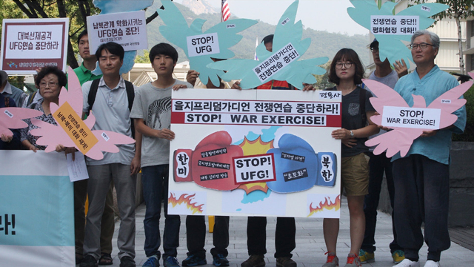 Aug. 17, 2015: South Korean protesters stage a rally demanding to stop the joint military exercises, Ulchi Freedom Guardian or UFG, between the U.S. and South Korea near the U.S. Embassy in Seoul, South Korea, The banner at center, reads 'Stop Ulchi Freedom Guardian exercise.' (AP Photo/Ahn Young-joon)