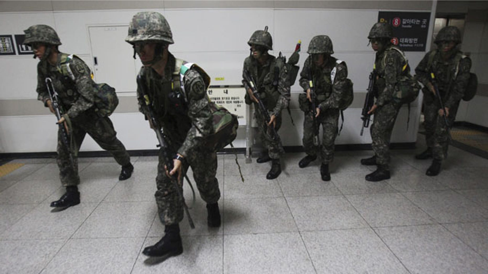 August 19, 2013: South Korean army soldiers take part in South Korea-U.S. joint military exercise, "Ulchi Focus Lens," at a subway station in Seoul. (AP Photo)