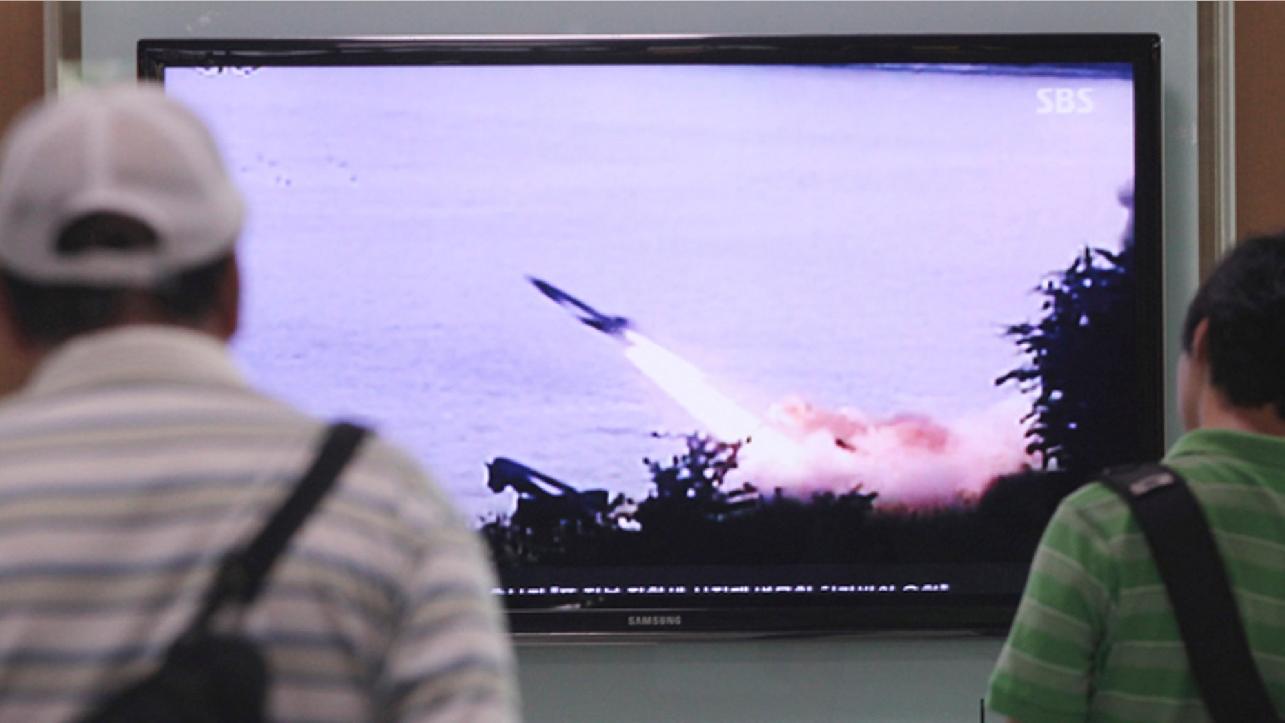 June 29, 2014: South Koreans watch a TV news program showing a missile launch conducted by North Korea, at Seoul Railway Station. North Korea fired two short-range missiles into its eastern waters Sunday, a South Korean official said, an apparent test fire that comes just days after the country tested what it called new precision-guided missiles. (AP Photo/Ahn Young-joon)