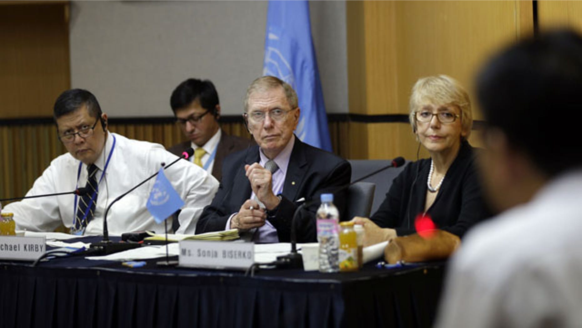 August 21, 2013: Michael Donald Kirby, center, the chairman of the U.N. commission of Inquiry on human rights in North Korea, listens to Ahn Myung-chul, right, who worked as a guard and driver at several political prisoner camps in the 1990s before defecting to south, during the U.N. hearing in Seoul, South Korea.