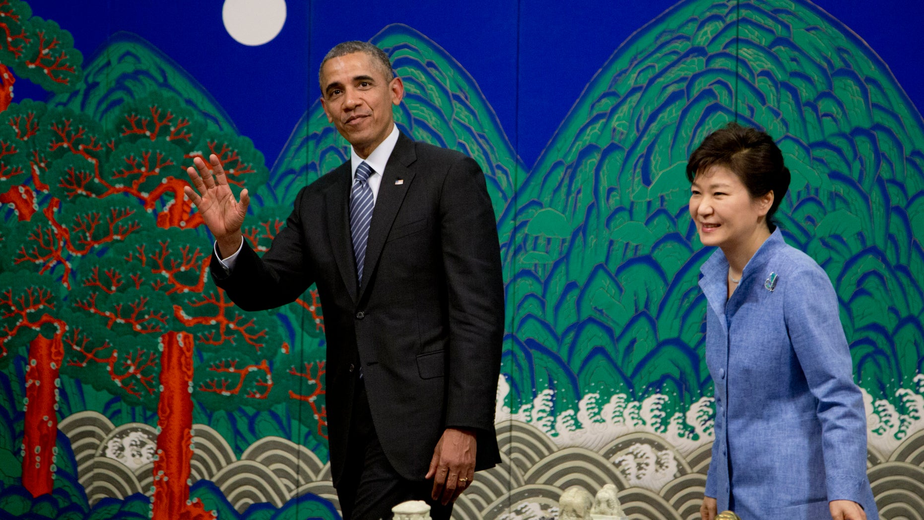 April 25, 2014 - President Obama waves to media as he leaves a ceremony with South Korean President Park Geun-hye at the Blue House, in Seoul, South Korea.
