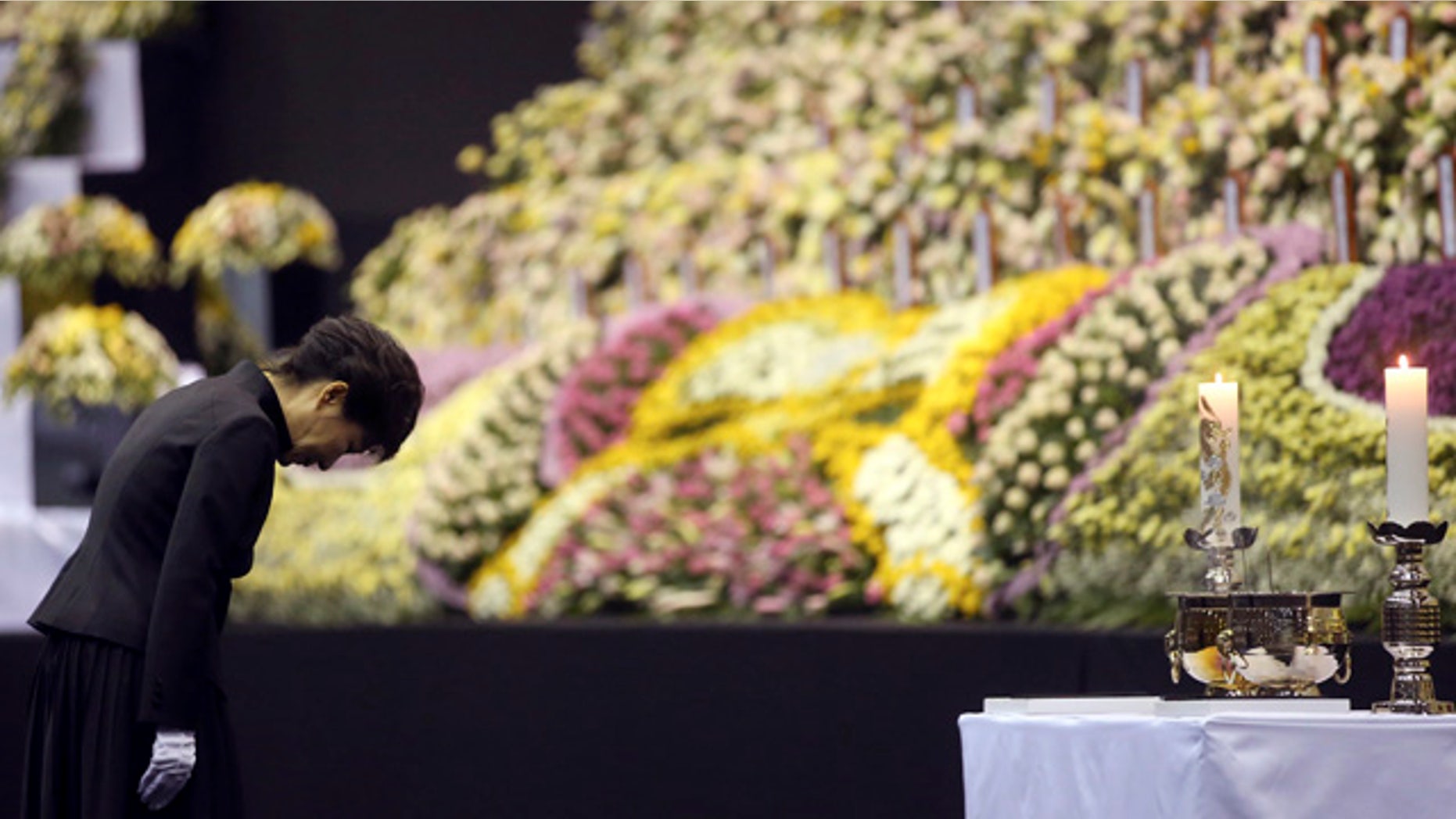 April 29, 2014: South Korean President Park Geun-hye pays tribute to the victims of the sunken ferry Sewol at a group memorial altar in Ansan, south of Seoul. (AP Photo/Yonhap)