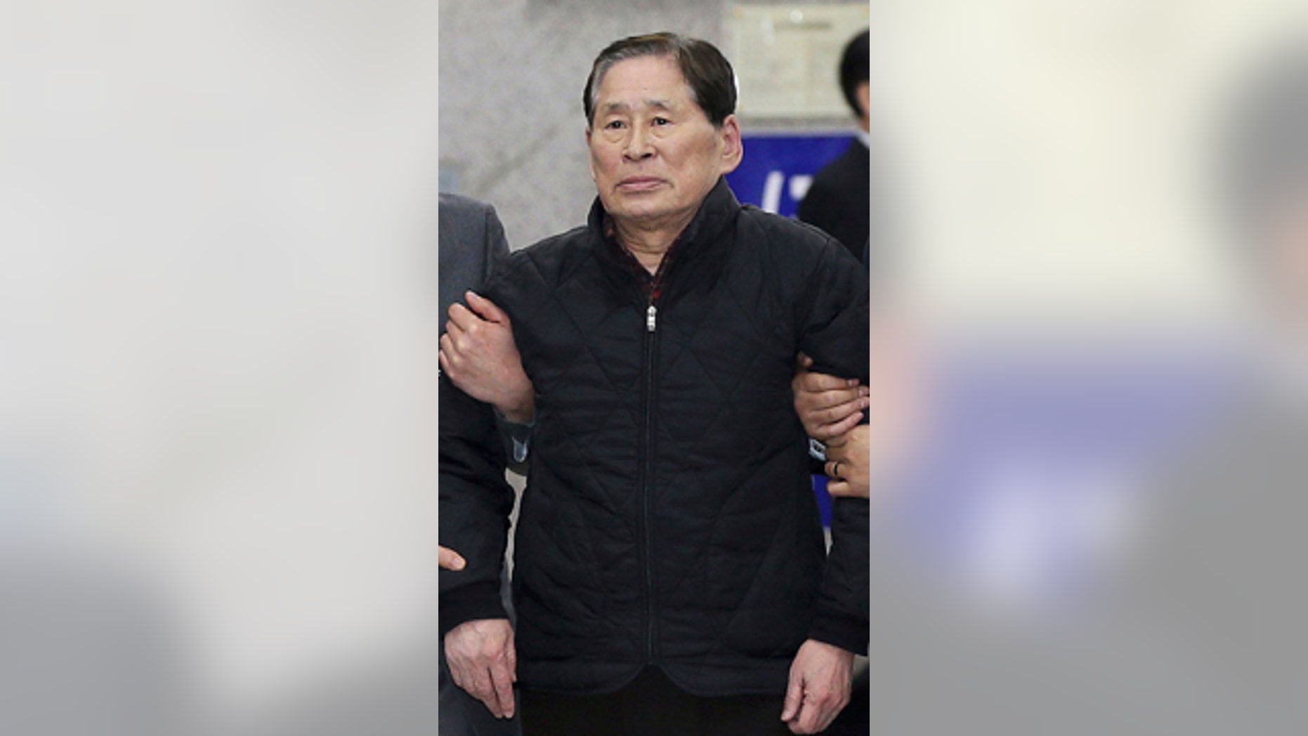 April 17, 2014: Kim Han-sik, president of Chonghaejin, is escorted by helpers to hold a press conference at Incheon Port International Passenger Terminal in Incheon, South Korea. South Korean prosecutors on Thursday detained Kim, the head of the company that owns the ferry that sank last month, over an allegation of cargo overloading.(AP Photo/Yonhap) KOREA OUT