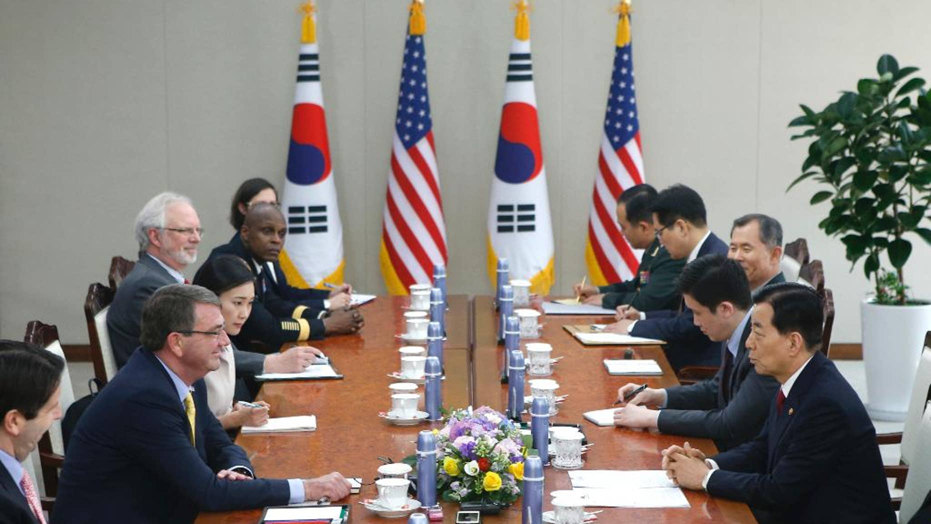 U.S. Defense Secretary Ash Carter, second left, talks with his South Korean counterpart Han Min Koo, right, during their meeting at the Defense Ministry in Seoul Friday, April 10, 2015. (AP Photo/Kim Hong-Ji, Pool)