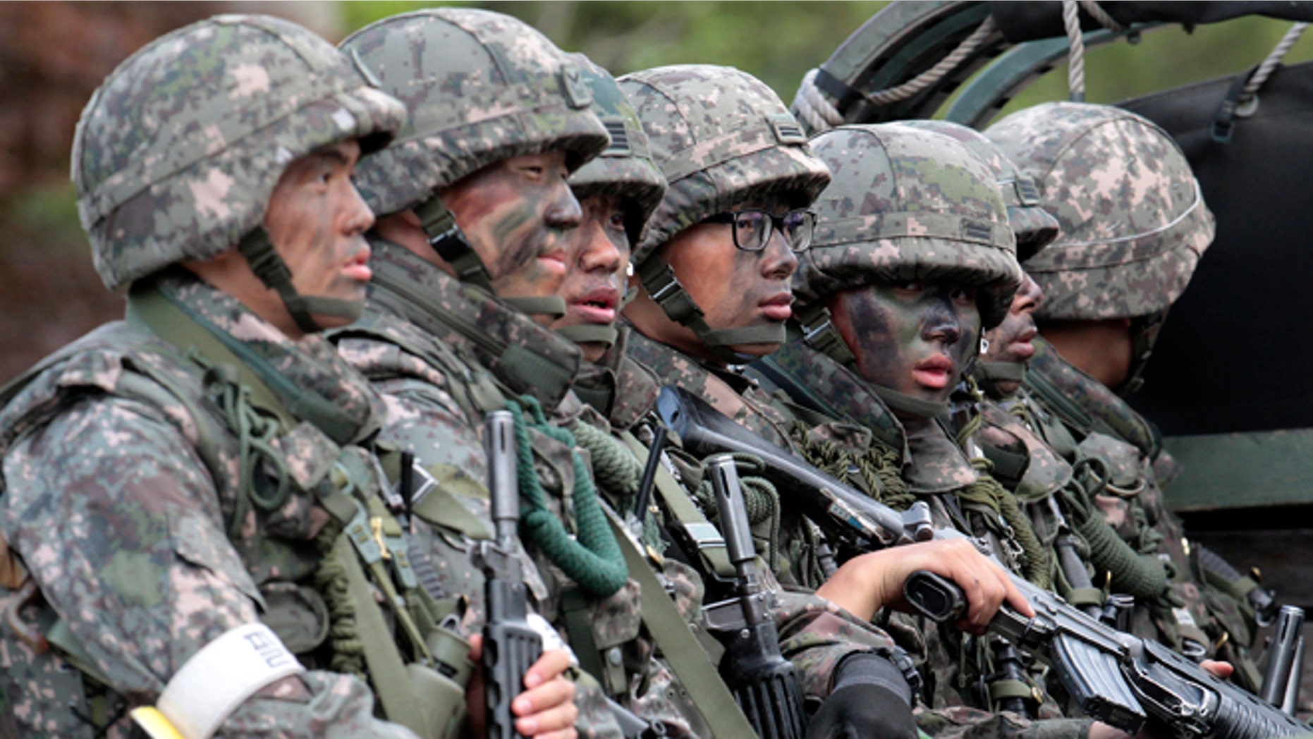 June 22, 2014: South Korean army soldiers on the truck head to search for a South Korean conscript soldier who was on the run after a shooting incident in Goseong, South Korea.