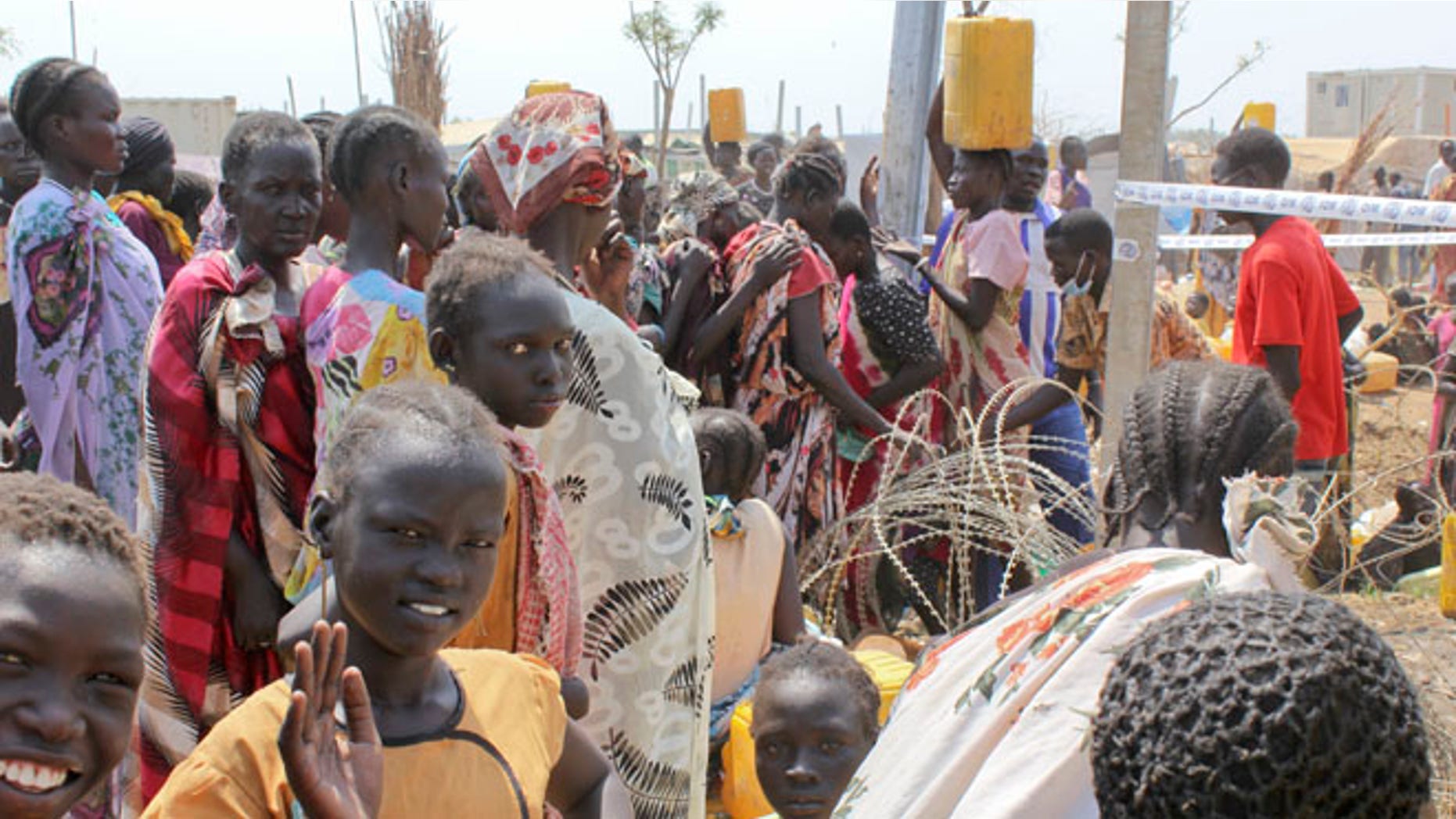Jan. 28, 2014: In this photo, displaced South Sudanese women queue for water at the United Nations base where they have sought shelter in Malakal, South Sudan.