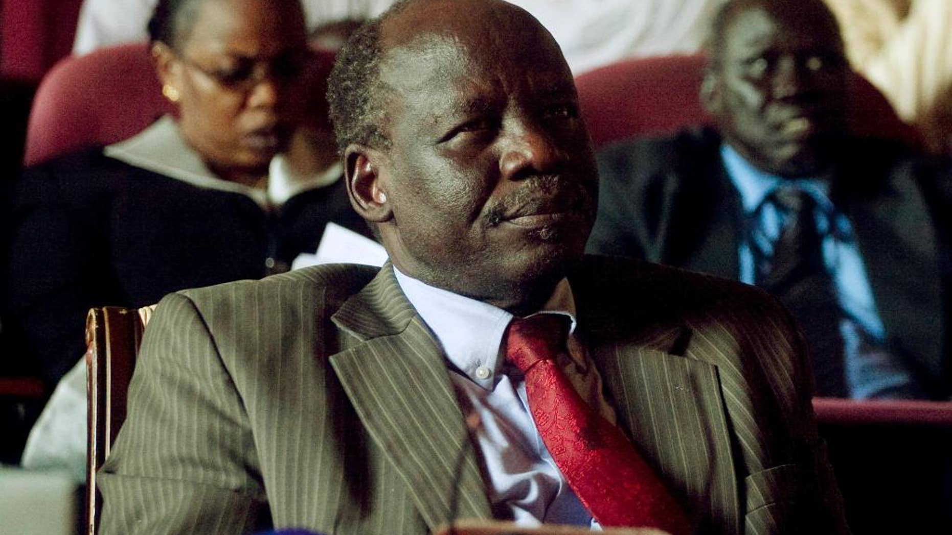 FILE - In this Wednesday, Oct. 13, 2010 file photo, Dr. Lam Akol, head of the Sudan People's Liberation Movement-Democratic Change party, listens during a discussion of southern unity and cooperation, during an all-southern-parties meeting in Juba, in then southern Sudan. South Sudanese opposition leader Lam Akol told The Associated Press Friday, April 24, 2015, that his house in the capital Juba was surrounded overnight by the country's security forces with security operatives closing the two roads leading to it, although they had not forced their way into his property. (AP Photo/Pete Muller, File)