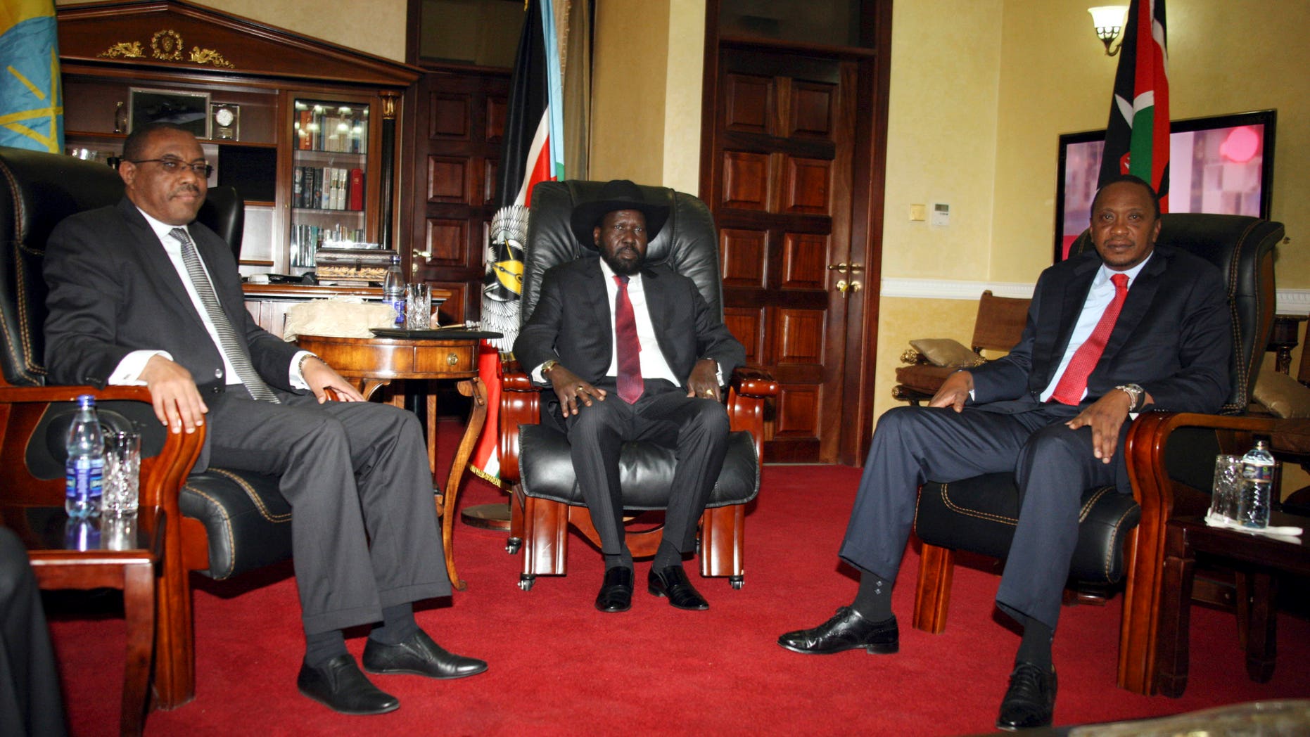 Dec. 26, 2013 - Ethiopian Prime Minister Hailemariam Desalegn, left, South Sudanese President Salva Kiir, center, and Kenyan President Uhuru Kenyatta pose for photos before their meeting at State House in Juba, South Sudan. The leaders of Kenya and Ethiopia arrived Thursday to try to mediate between the country's president and the political rivals he accuses of attempting a coup that the government insists sparked violence threatening to destroy the world's newest country.
