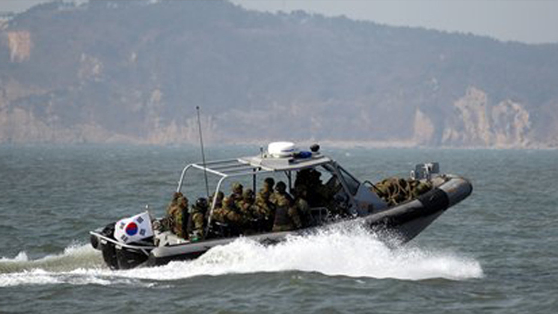 Feb. 20, 2012: South Korean navy sailors in a speed boat patrol around South Korea's western Yeonpyong Island after finishing their exercise, near the disputed sea border with North Korea.