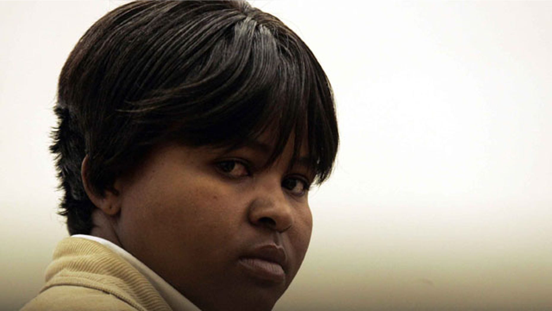In this July 29, 2008 file photo, South African Tiny Virginia Makopo stands in the dock, at the start of a trial at the Sebokeng Magistrate Court, south of Johannesburg, South Africa.