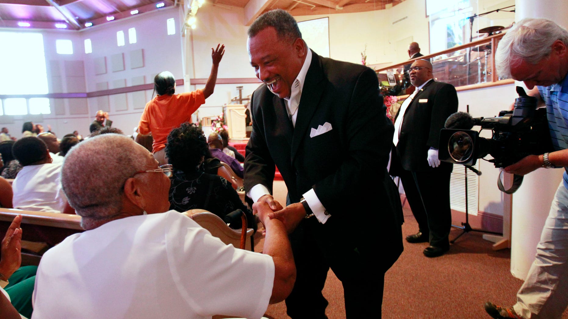 June 3: Reverend Fred Luter, pastor of the Franklin Ave. Baptist Church, greets congregation members during Sunday Services at the Church in New Orleans.
