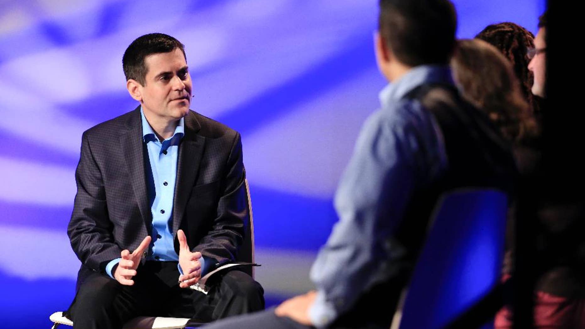FILE - In this Oct. 28, 2014 file photo, Rev. Russell Moore, left, director of the Southern Baptist’s Ethics and Religious Liberty Commission, leads a discussion during the group's national conference in Nashville, Tenn. Moore is one of several white leaders calling for multiethnic congregations in the wake of the unrest spurred by the killings of black men by white police officers in Ferguson, Missouri, and New York City. (AP Photo/Mark Humphrey)