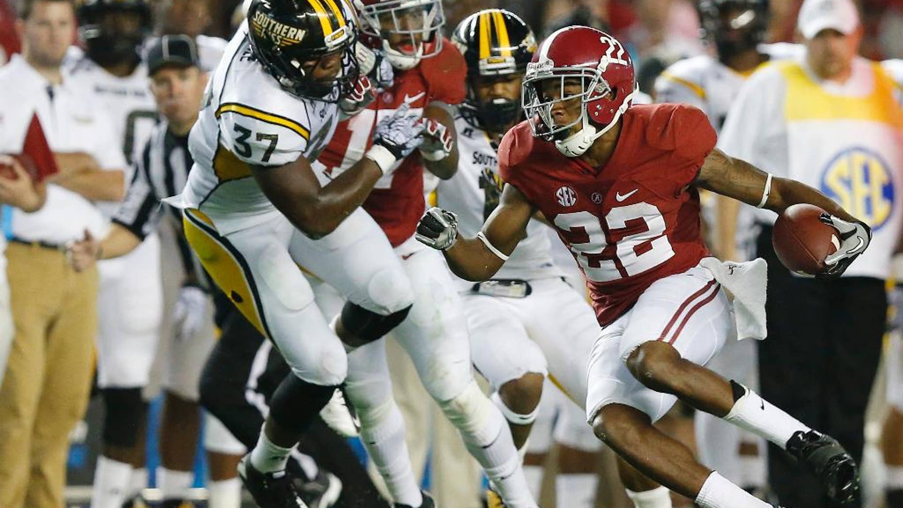 Alabama wide receiver Christion Jones (22) runs the ball during the second half of an NCAA college football game against Southern Mississippi on Saturday, Sept. 13, 2014, in Tuscaloosa, Ala. (AP Photo/Brynn Anderson)