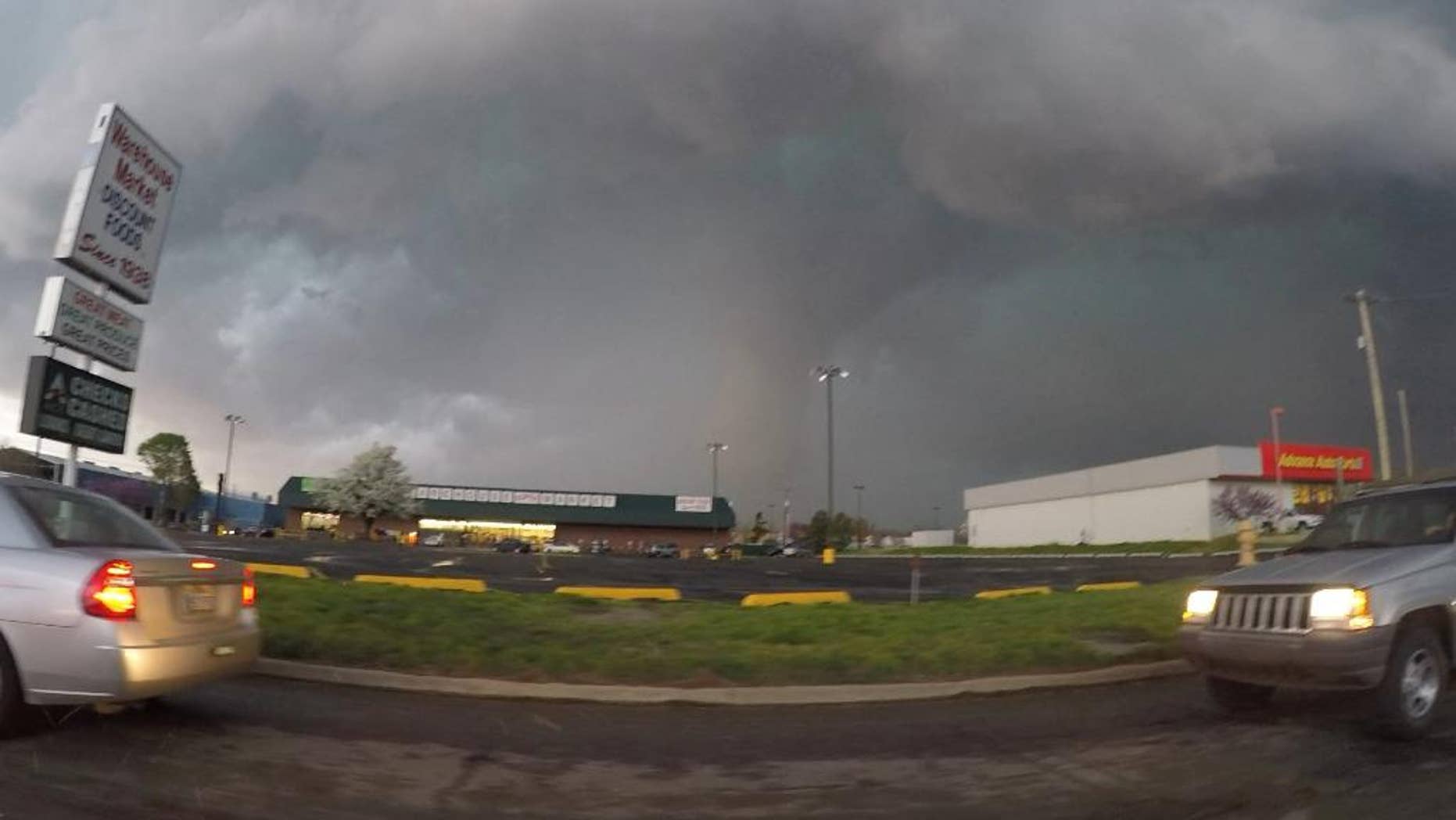 This frame taken from video provided by Brenton Leete shows a funnel cloud in part of a storm Wednesday, March 25, 2015, in Sand Springs, Okla. The slow start to the nation's tornado season came to a blustery end Wednesday when tornadoes hit Arkansas and Oklahoma. (AP Photo/Brenton Leete)