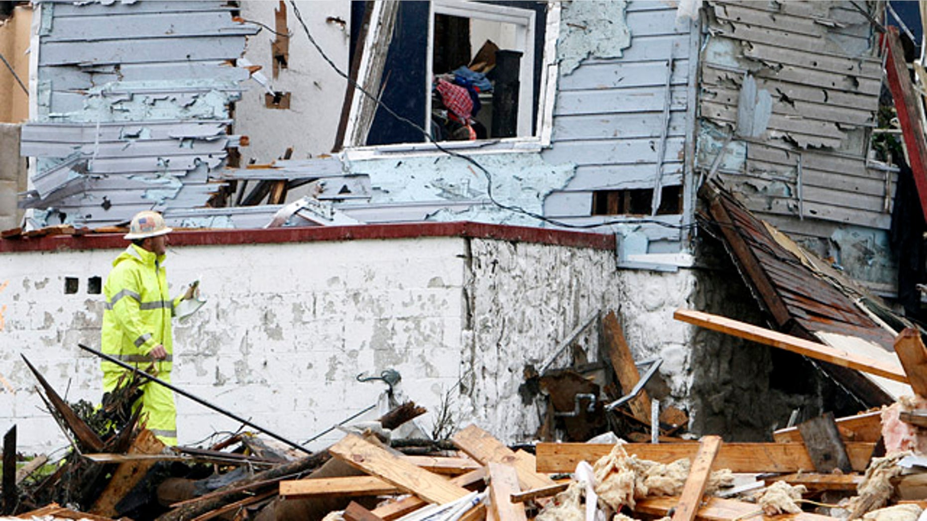 May 3: A Natural gas worker inspects a house that was destroyed when a tornado ripped through Pratt City. (AP)