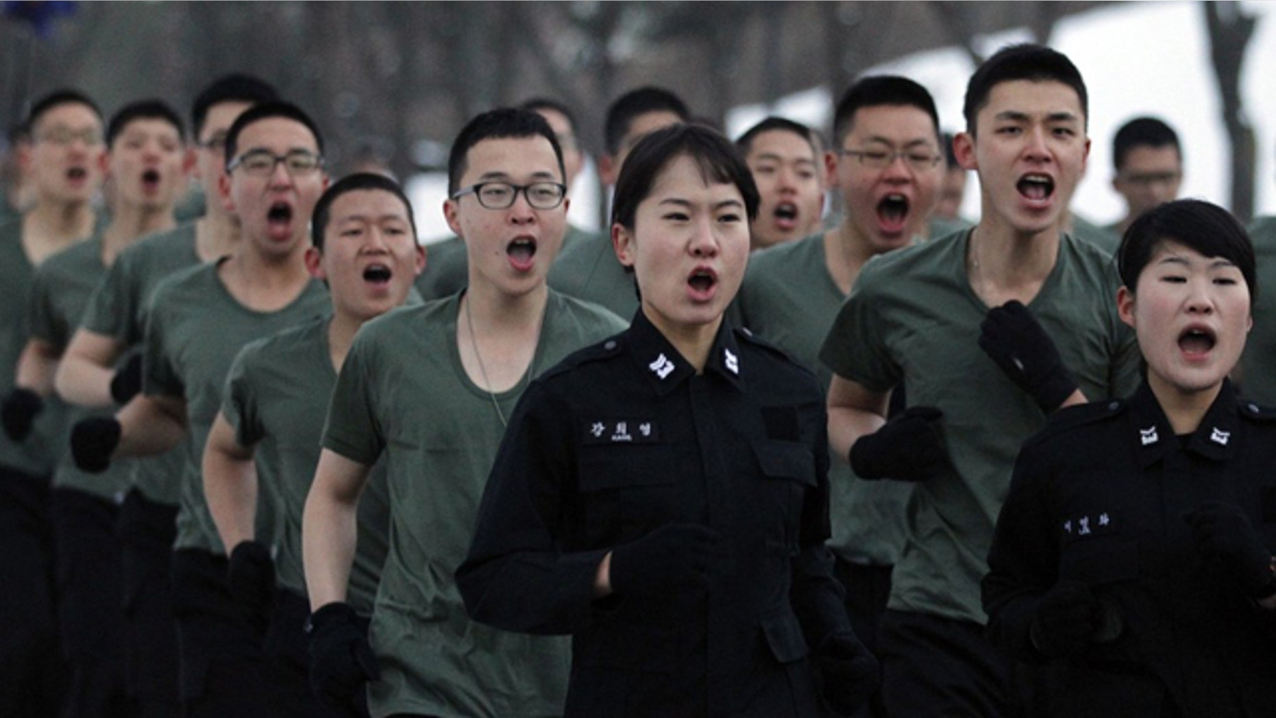 South Korean soldiers of the capital defense command run at a training at barracks of the command in Seoul