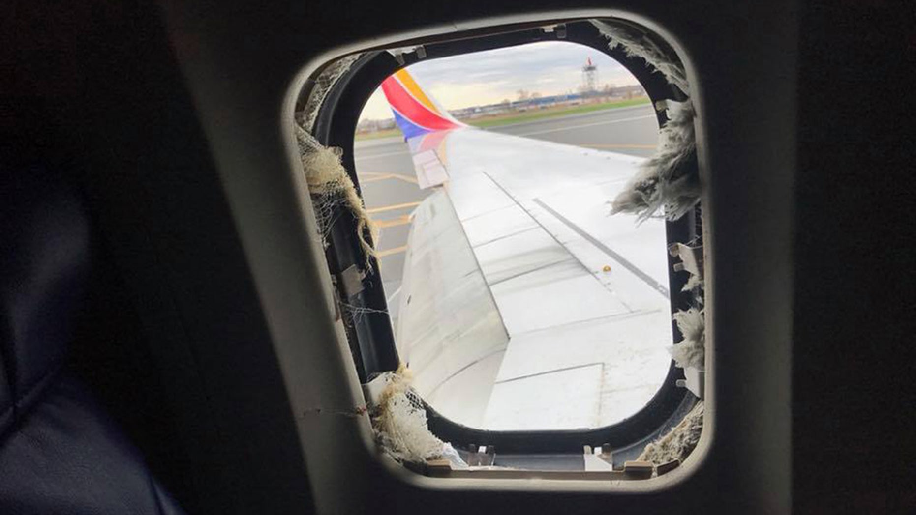 During a terrifying Southwest flight, one woman was “partially sucked out” of the airplane’s window after a piece of shrapnel reportedly broke through.