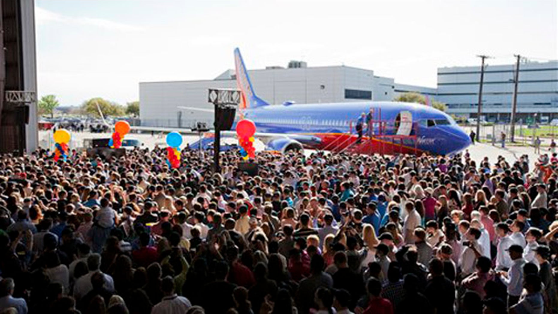 March 21, 2012: Southwest Airlines employees get a first look at the Boeing 737-800 during a launch party in Dallas, Texas.