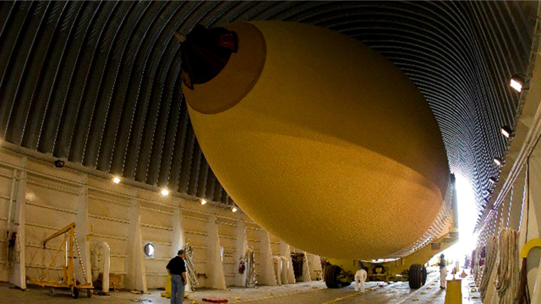 Space shuttle Discovery's external fuel tank, ET-137, is loaded into its Pegasus barge at the Michoud Assembly Facility in New Orleans for shipment to NASA's Kennedy Space Center. The planned 6-day delivery was hampered by a massive oil spill in the Gulf of Mexico, which forced NASA to hire a commercial tug for part of the journey.