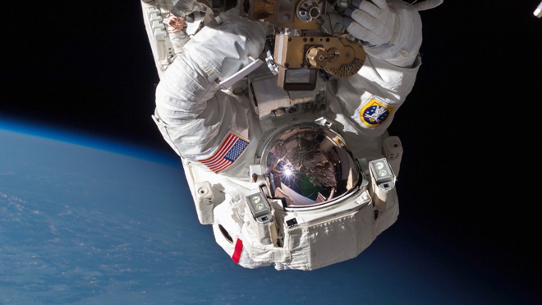 Astronaut Chris Cassidy performs a space walk to inspect and replace a pump controller box on the International Space Station after an ammonia coolant leak was discovered in May, 2013.