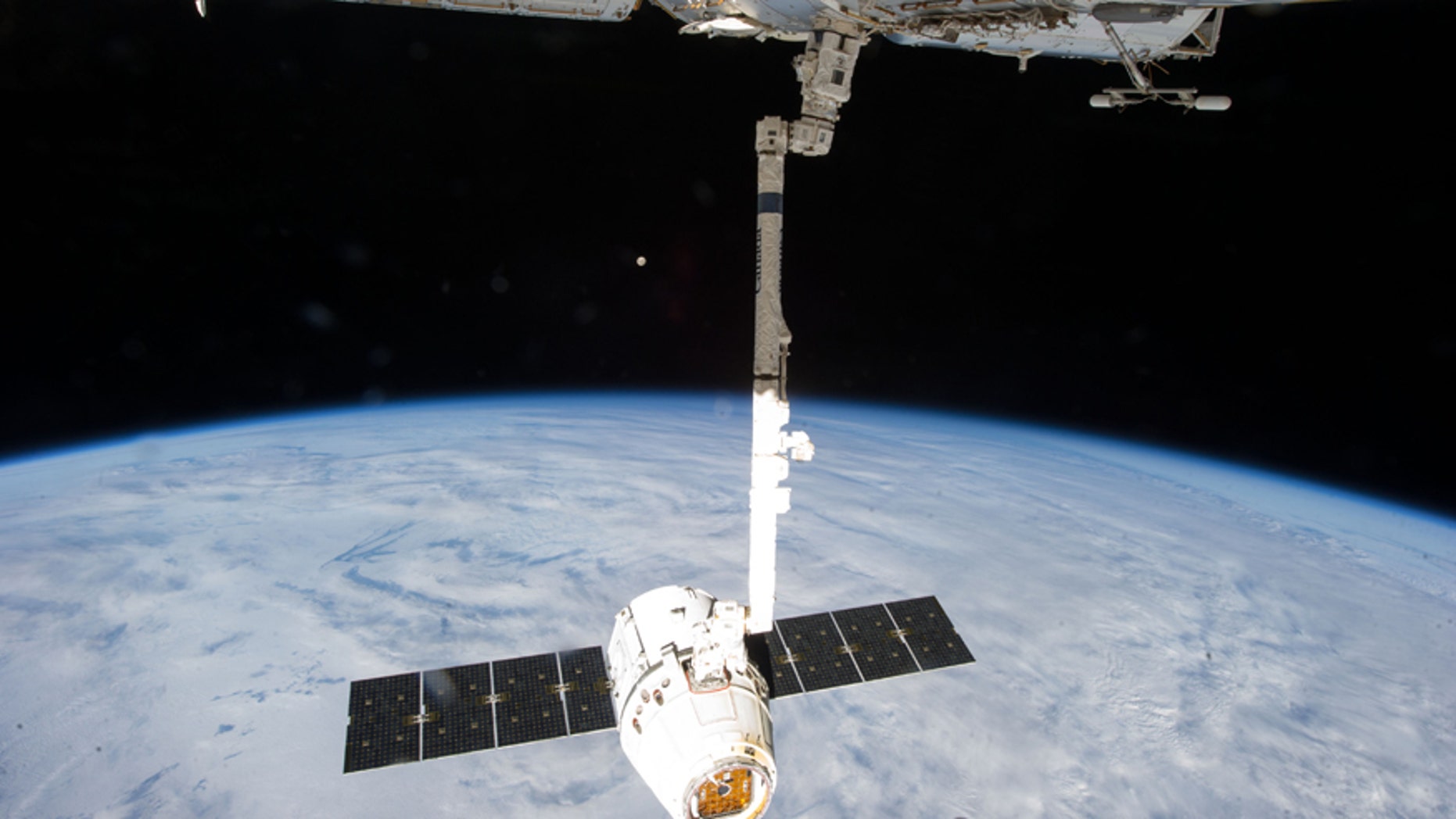 This Tuesday, March 26, 2013 file photo provided by NASA shows the release of the SpaceX Dragon-2 spacecraft from the International Space Station. NASA is pressing ahead, on Monday, April 14, 2014, with the planned launch of a supply ship despite a critical computer outage at the International Space Station, promising the situation is safe.