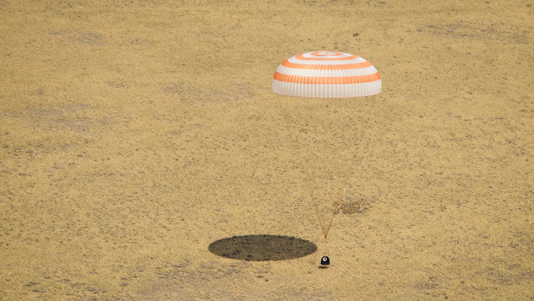 July 1, 2012: The Soyuz TMA-03M spacecraft is seen as it lands with Expedition 31 Commander Oleg Kononenko of Russia and Flight Engineers Don Pettit of NASA and Andre Kuipers of the European Space Agency in a remote area near the town of Zhezkazgan, Kazakhstan.