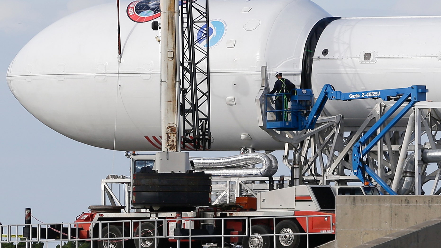 File photo - Maintenance is performed by workers on the Falcon 9 SpaceX rocket at launch complex 40 at the Cape Canaveral Air Force Station in Cape Canaveral, Fla., Monday, Feb. 9, 2015.
