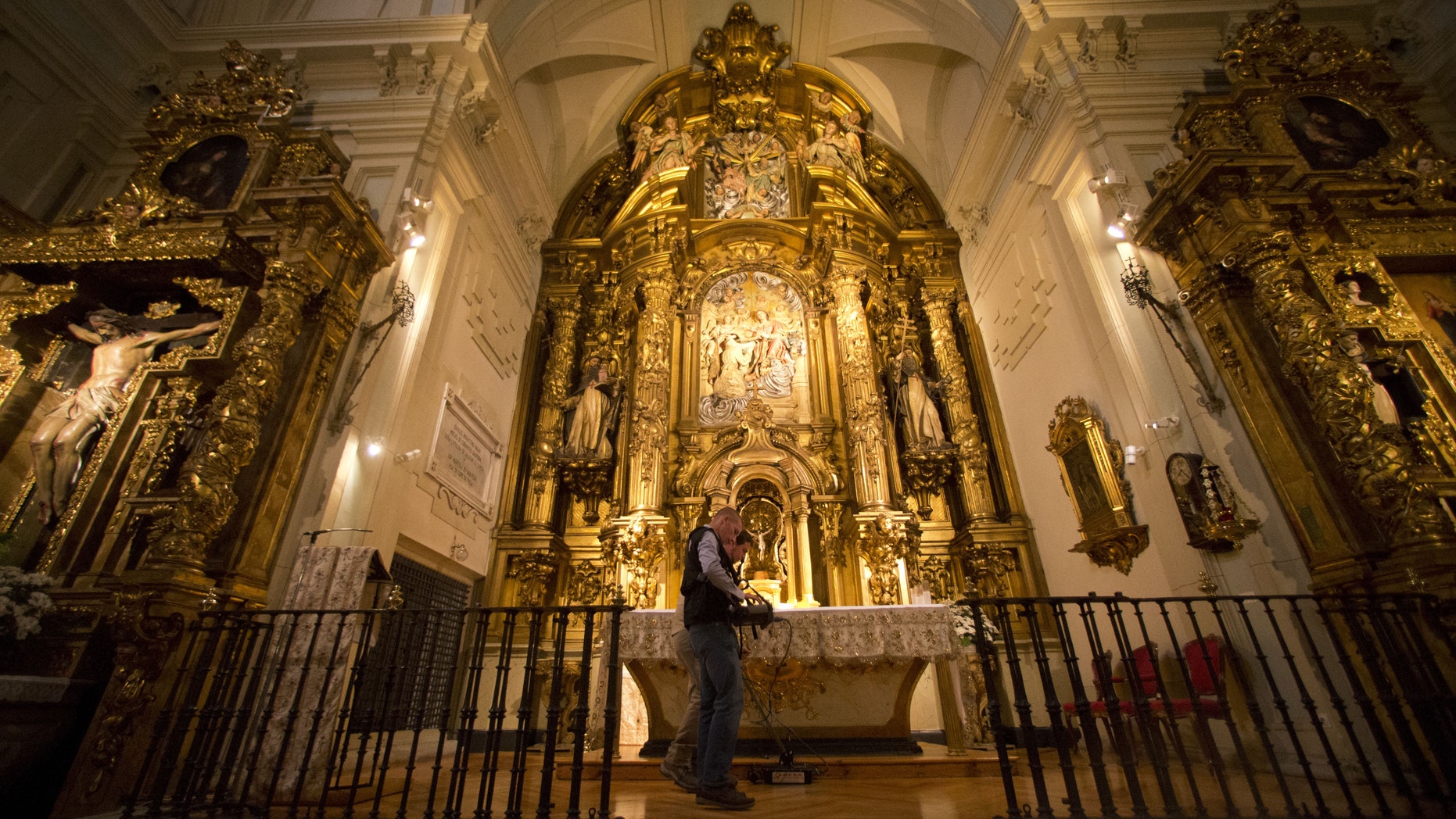 Two operators scan the altar with a Ground Penetration Radar at the Convent of the Barefoot Trinitarians in the historic Barrio de las Letras, or Literary Quarter in Madrid, Spain, Monday, April 28, 2014.