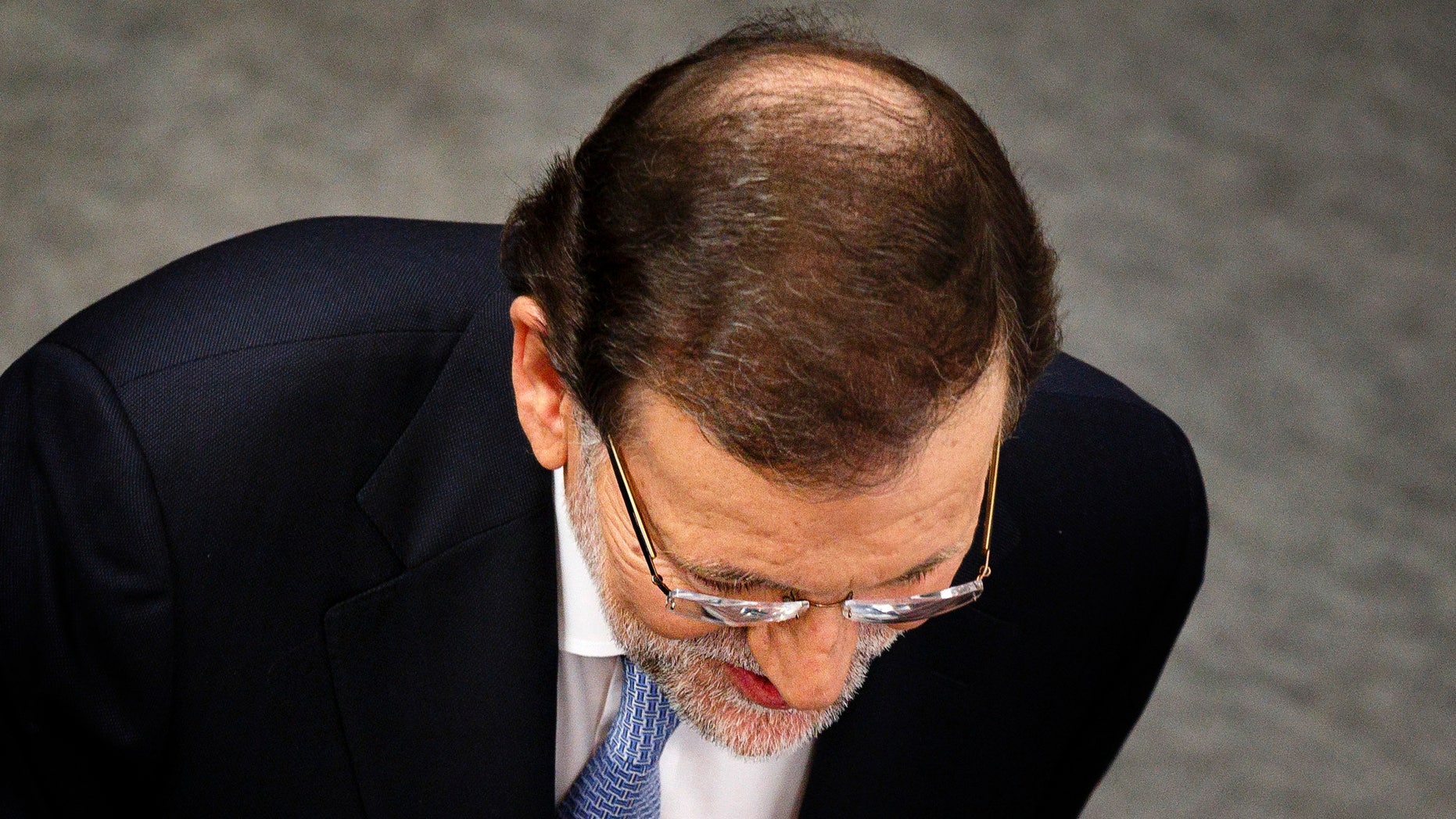 Spain's Prime Minister and Popular Party candidate Mariano Rajoy arrives to a TV studio before the start of a live televised debate with Socialist Party Pedro Sanchez, in Madrid, Spain, Monday, Dec. 14, 2015.(AP Photo/Daniel Ochoa de Olza)