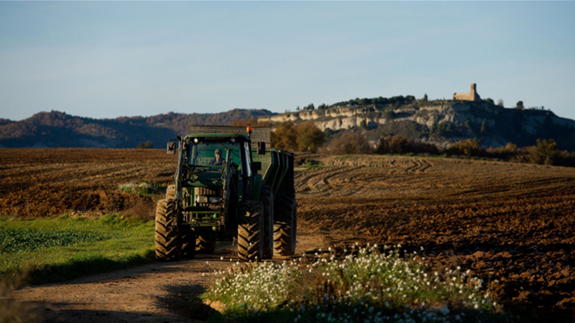 VIC, SPAIN - NOVEMBER 20: A farmer works with his tractor on November 20, 2012 in Vic, Spain. Over 5 million Catalans will be voting in Parliamentary elections on November 25. (Photo by David Ramos/Getty Images)