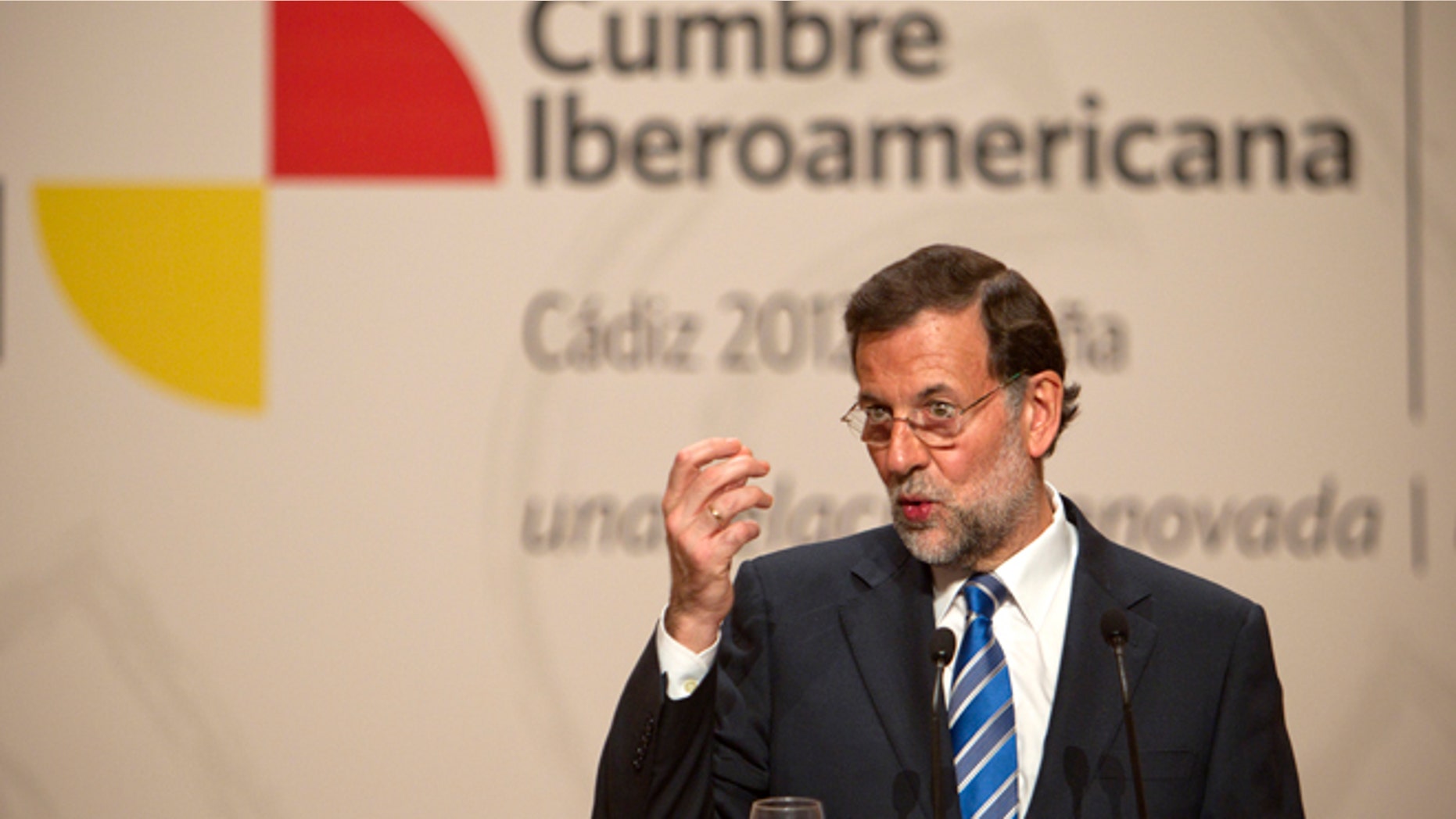 Spain's Prime Minister Mariano Rajoy, gestures during a press conference at the XXII Iberoamerican summit in the southern Spanish city of Cadiz, Saturday, Nov. 17, 2012. In an historic role reversal, recession-hit Spain and Portugal on Friday courted the Latin American leaders of their former colonies, countries that now enjoy some of the strongest economic growth in the world. Spain's King Juan Carlos opened the annual Iberoamerican summit, which brings together the heads of Spain and Portugal and the leaders of Latin America to discuss political issues and arrange business deals. (AP Photo/Miguel Angel Morenatti)