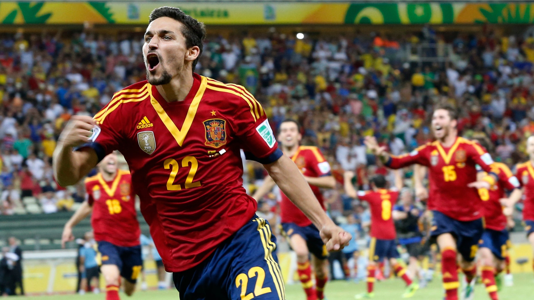 Spain's Jesus Navas celebrates after scoring his side winning penalty against Italy during the soccer Confederations Cup semifinal match at the Castelao stadium in Fortaleza, Brazil, Thursday, June 27, 2013.