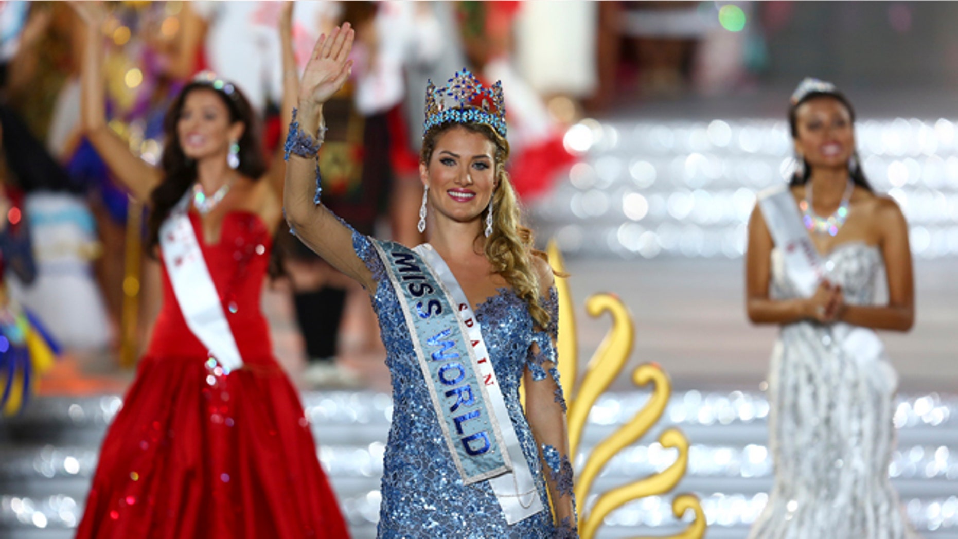 Newly crowned Miss World Mireia Lalaguna Royo from Spain celebrates after at the end of the 2015 Miss World Grand Final in Sanya in south China's Hainan province Saturday Dec. 19, 2015. Spain's Mireia Lalaguna Royo was named the winner of the Miss World 2015 competition Saturday night in the southern Chinese island resort of Sanya, an event dogged by controversy over China's refusal to allow Canada's entrant to attend. (Chinatopix Via AP) CHINA OUT