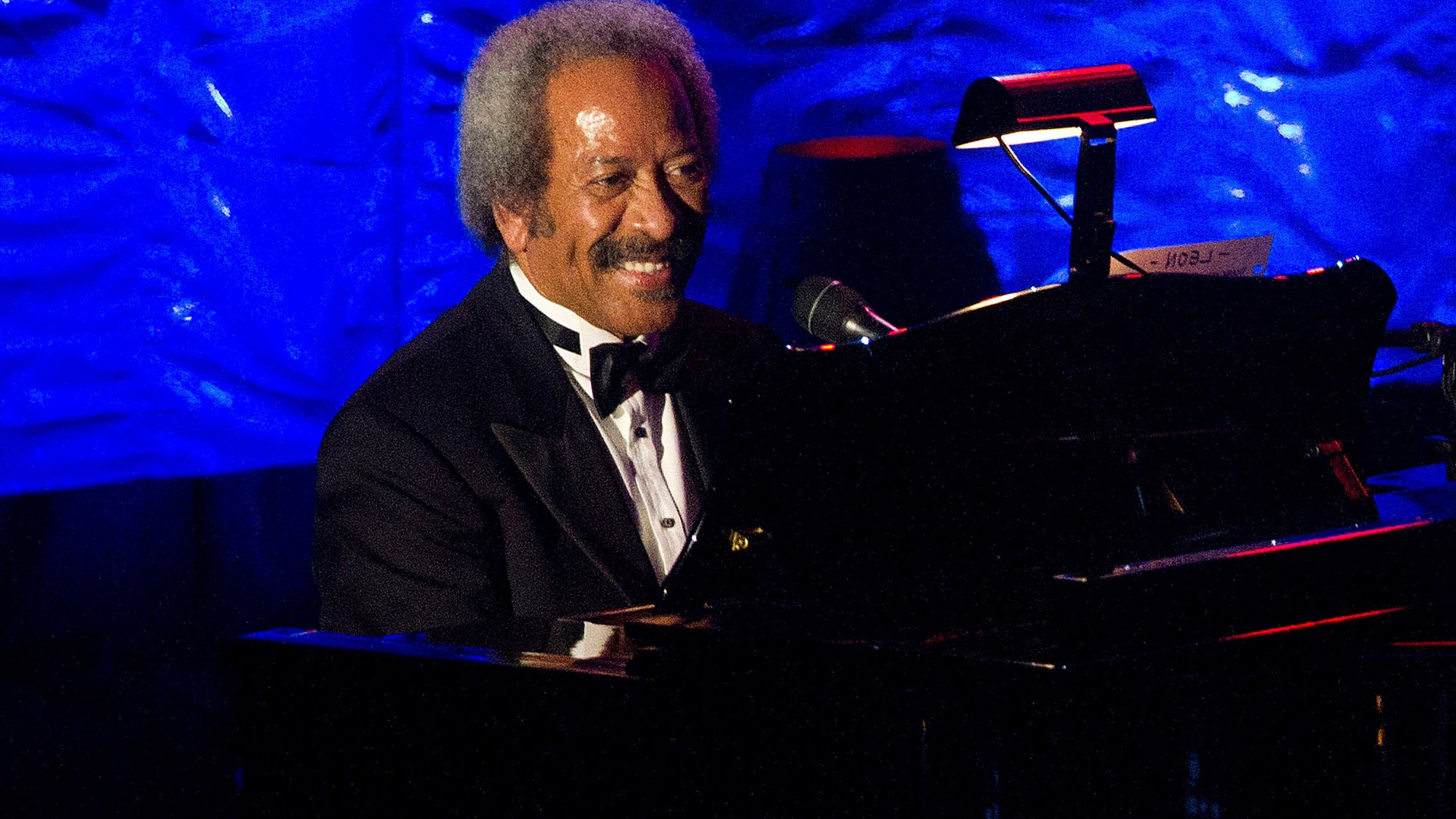 FILE - In this June 16, 2011 file photo, Allen Toussaint performs onstage at the 42nd Annual Songwriters Hall of Fame Awards in New York. Legendary New Orleans musician and composer Allen Toussaint has died after suffering a heart attack following a concert he performed in the Spanish capital. Madrid emergency services spokesman Javier Ayuso says rescue workers were called to Toussaint's hotel early Monday Nov. 9, 2015 and managed to revive him after he suffered a heart attack but he stopped breathing during the ambulance ride to a hospital and efforts to revive him again were unsuccessful. Toussaint performed Sunday night at Madrid's Lara Theater. (AP Photo/Charles Sykes, File)