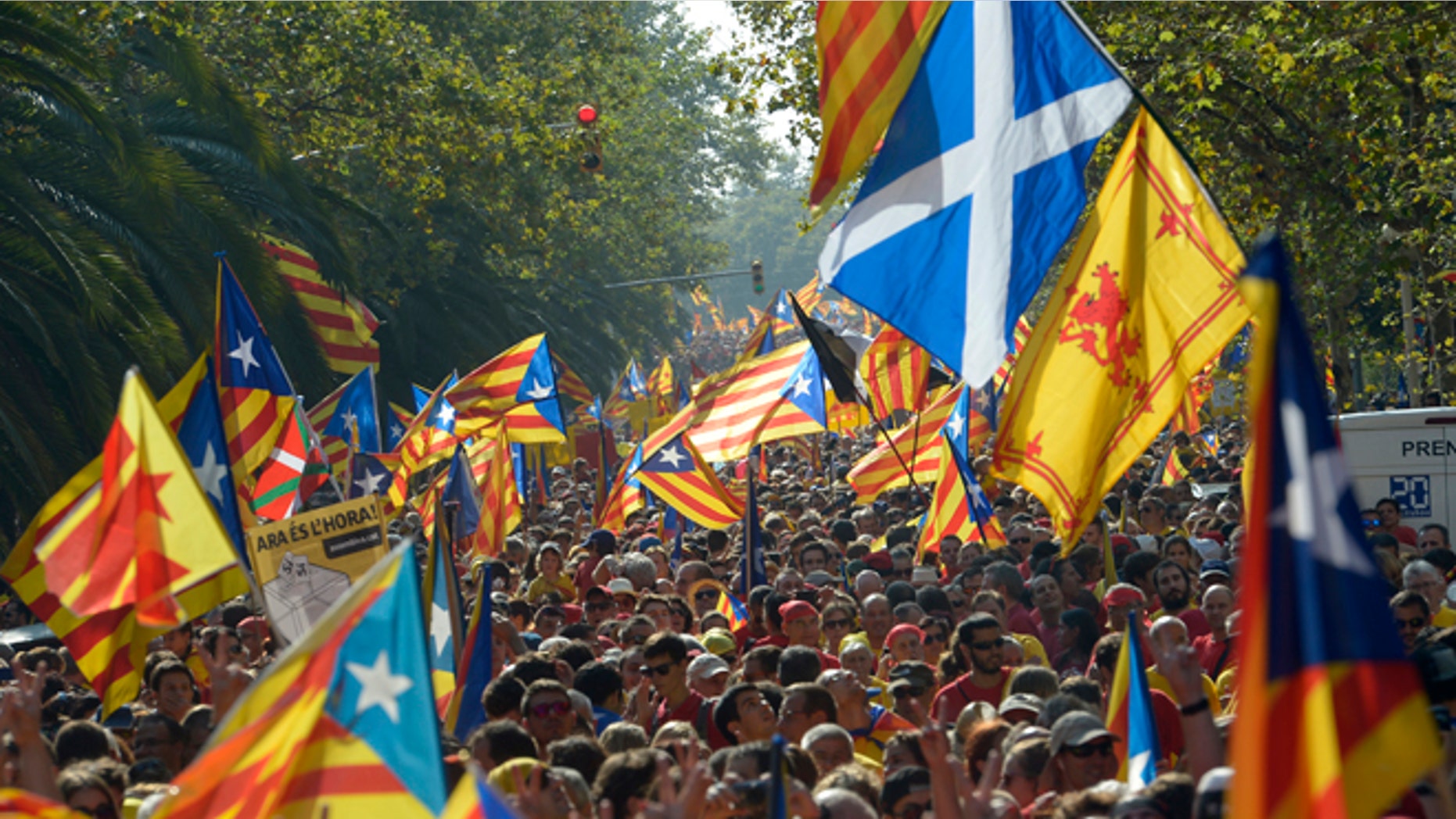 A Saltire flag, top right, is seen amongst estelada flags, symbolizing Catalonia's independence, during a demonstration calling for the independence of Catalonia in Barcelona, Spain, Thursday, Sept 11, 2014. A week before Scotland votes on whether to break away from the United Kingdom, separatists in northeastern Spain were trying to convince hundreds of thousands to protest across Catalonia to demand a secession sentiment vote that the central government in Madrid insists would be illegal. AP Photo/Manu Fernandez)