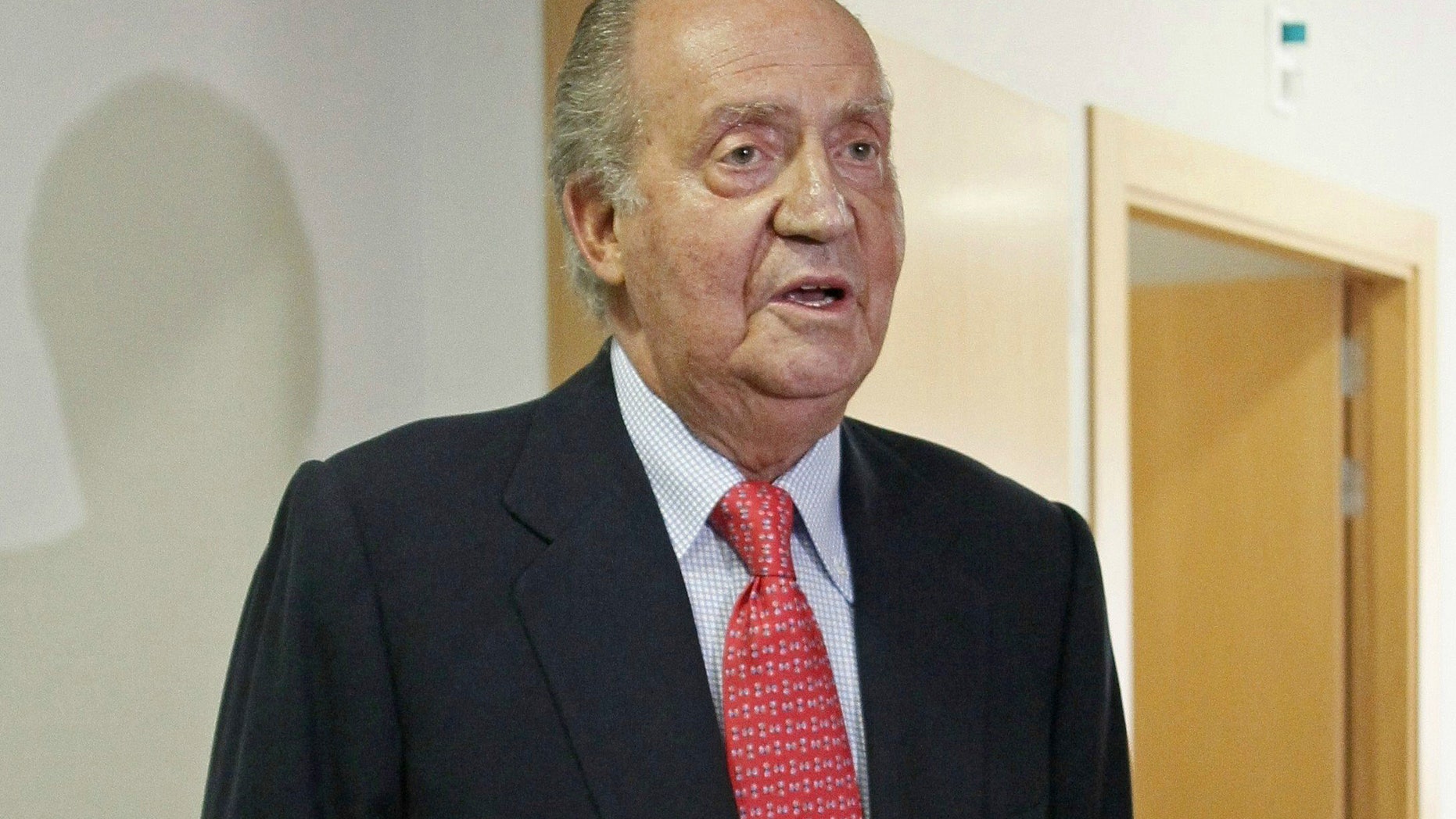April 18, 2012: Spain's King Juan Carlos prepares to leave a hospital in Madrid.