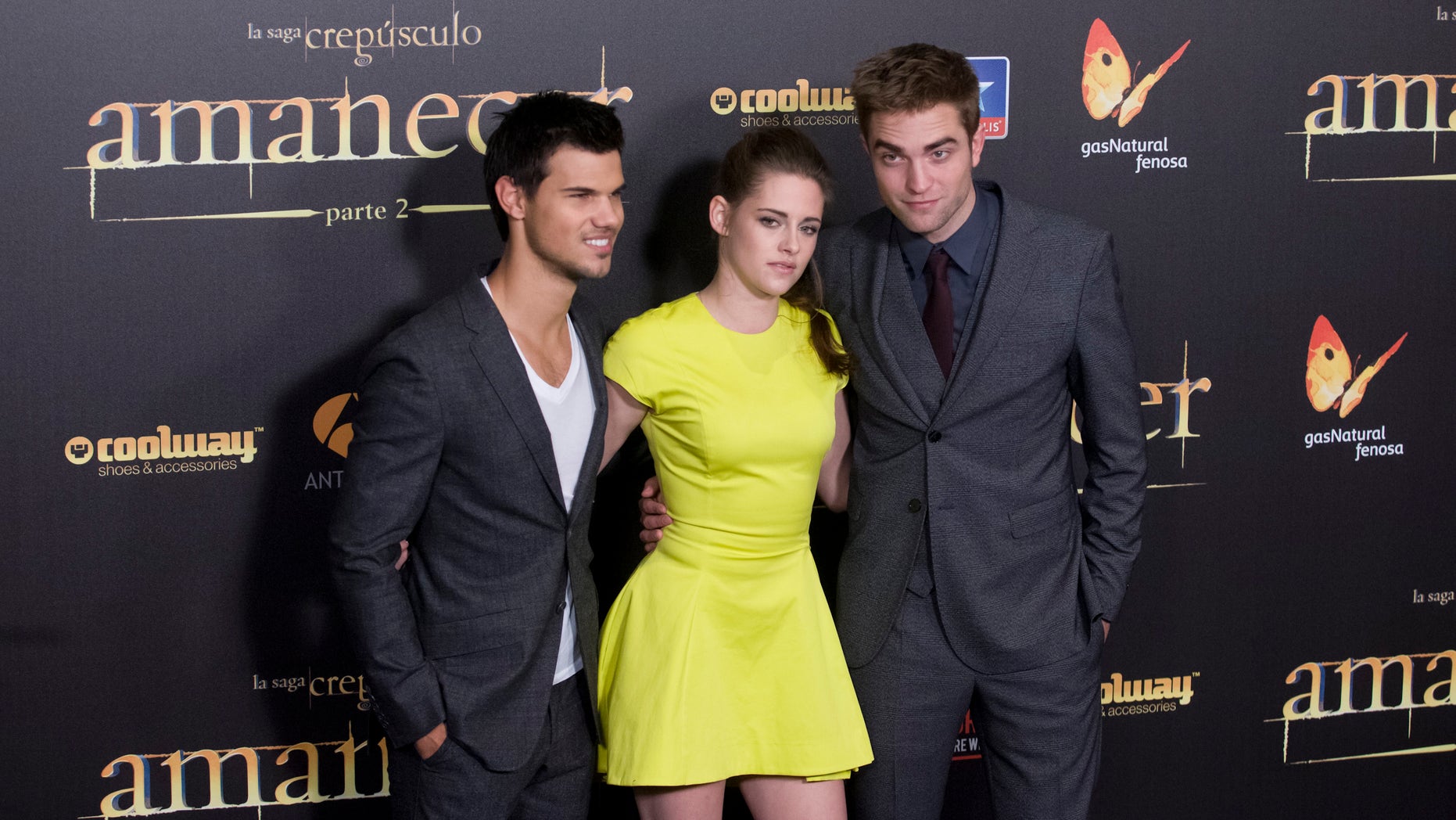 American actor Taylor Lautner, left American actress Kristen Stewart, center and British actor Robert Pattinson pose during a photo call at the Spanish premiere of the film "The Twilight Saga: Breaking Dawn-Part 2" in Kinepolis Cinema in Madrid, Spain, Thursday, Nov. 15, 2012. ( AP Photo/Gabriel Pecot)